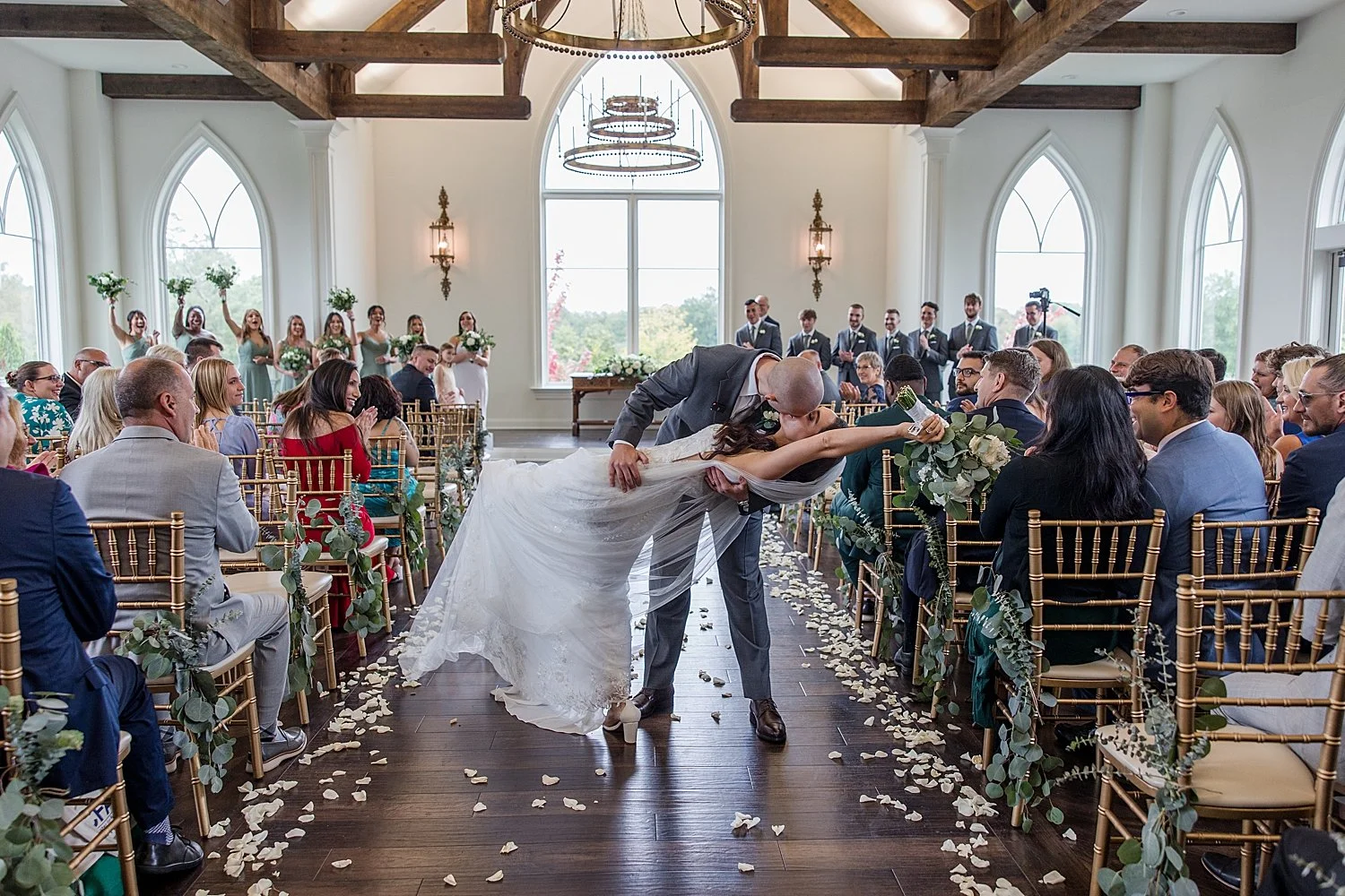  Newlyweds kiss as they walk down aisle of wedding  