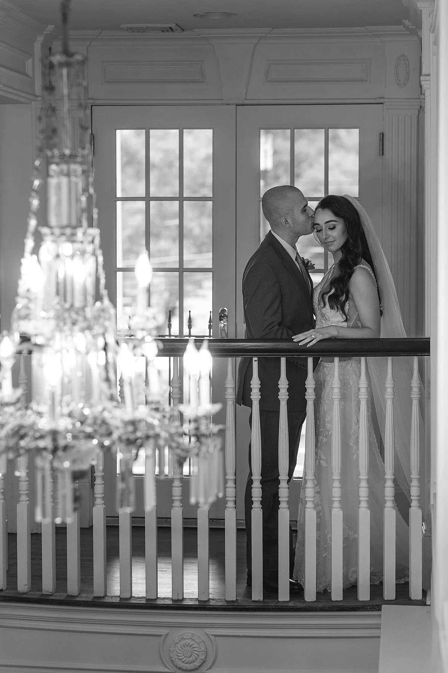  bride and groom at top of stairs  
