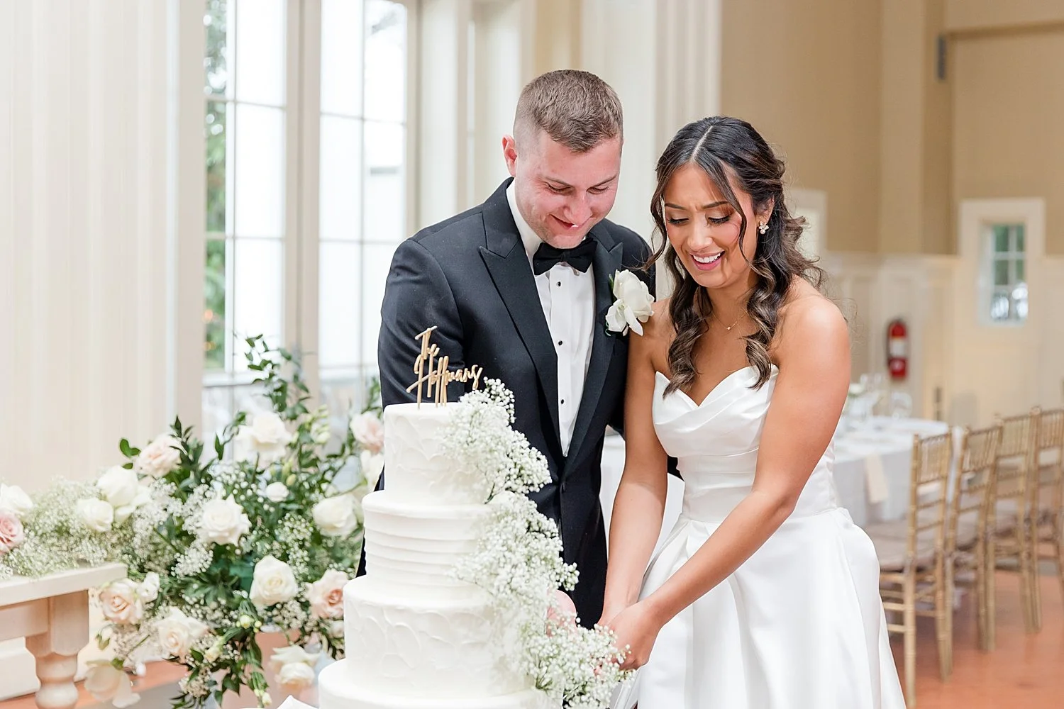 bride and groom cut their wedding cake  