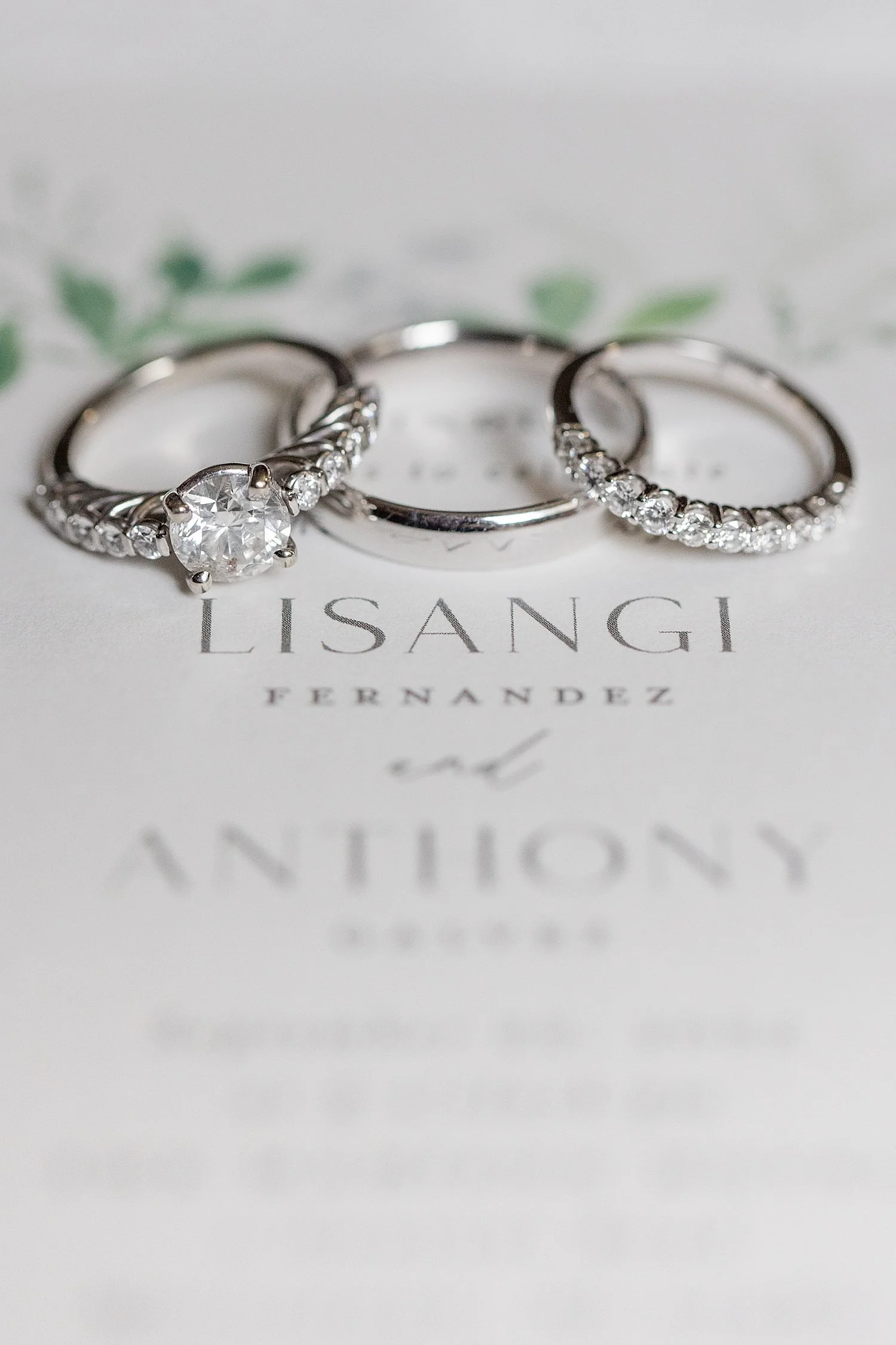  wedding rings on white invitation 