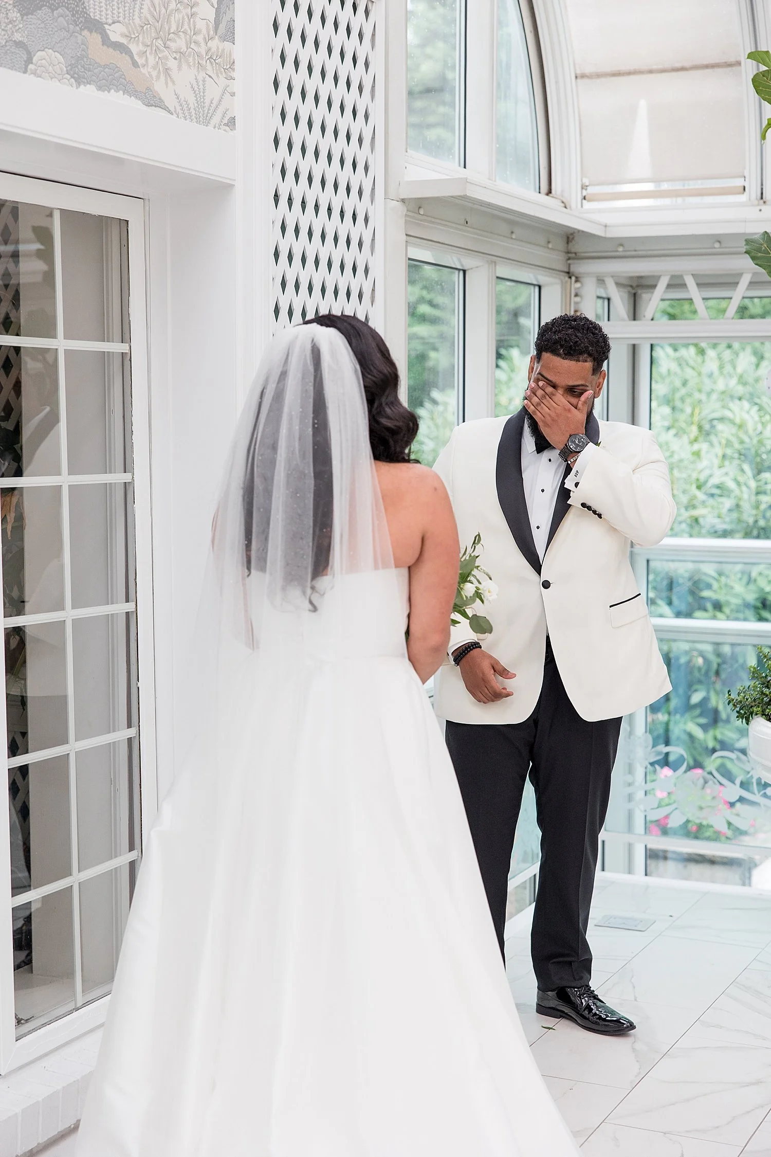  groom’s emotional reaction to seeing bride for the first time in wedding dress 