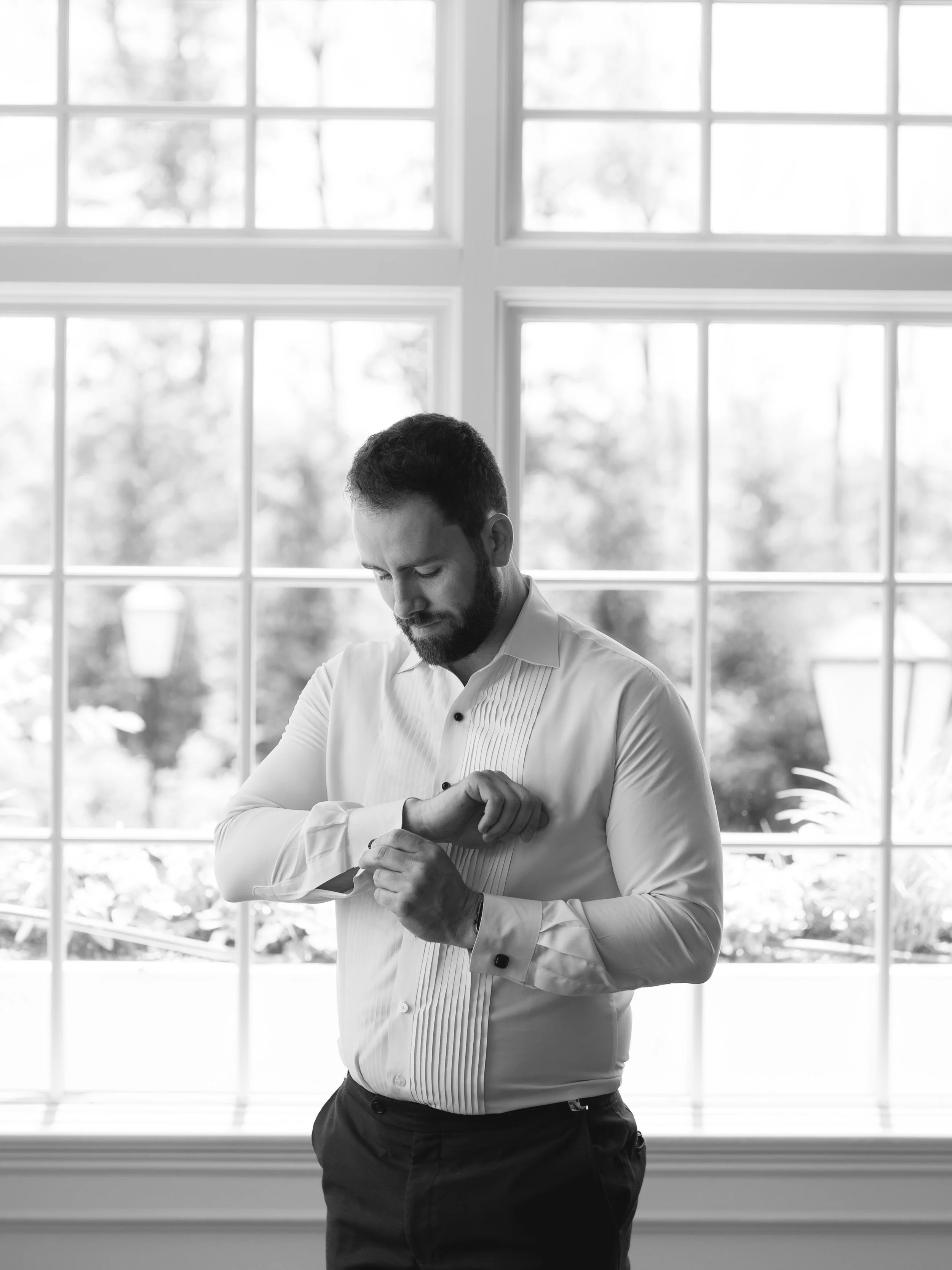 Black and white groom solo shot getting ready at The Park Savoy Estate in Florham Park, NJ by wedding photographer, Jessica Anne Photography