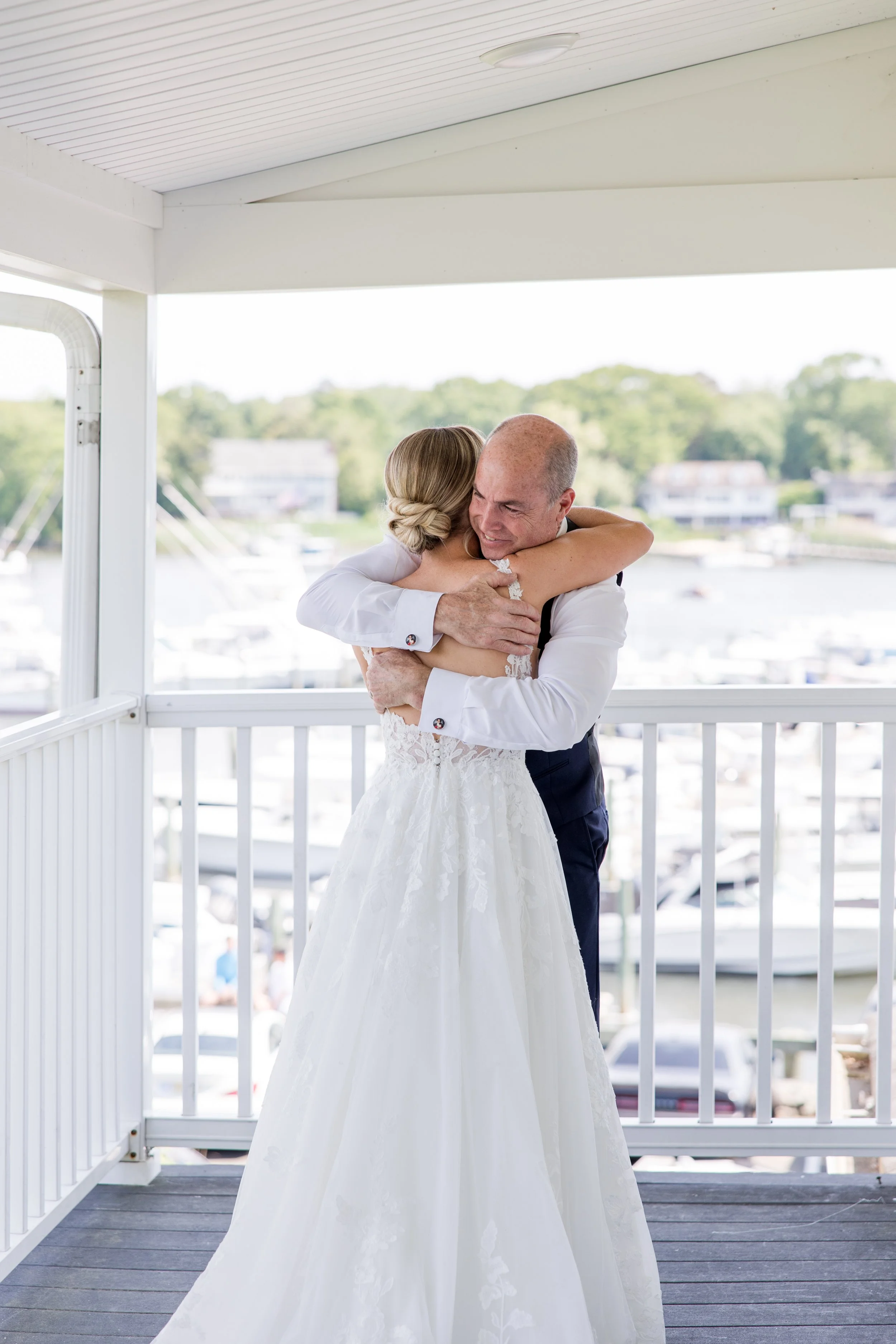 Father of the bride hugging first look photo by Jessica Anne Photography at Crystal Point Yacht Club in Point Pleasant, NJ