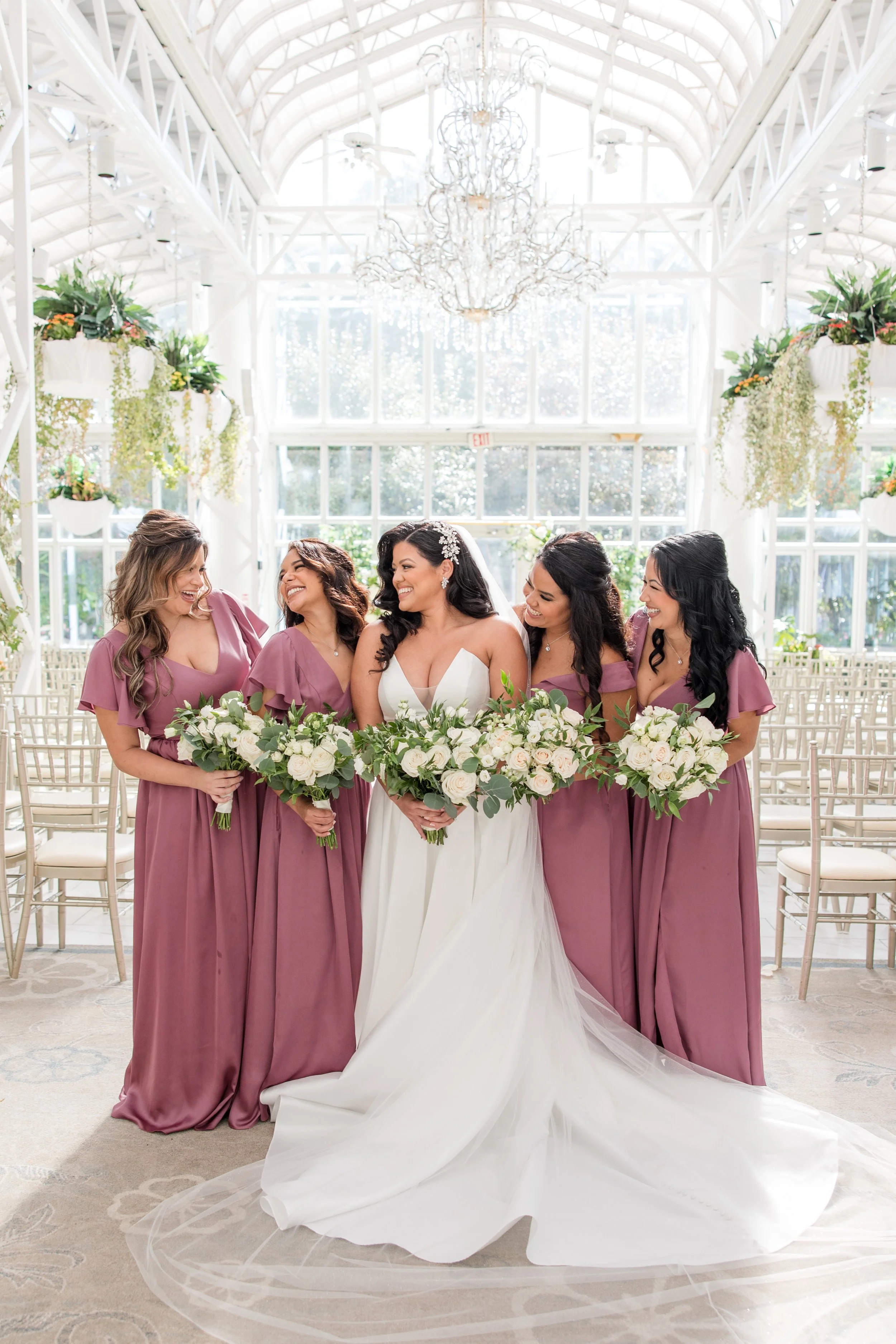 Bride and bridesmaids photo in greenhouse at The Park Savoy Estate in Florham Park, New Jersey. Shot by Jessica Anne Photography