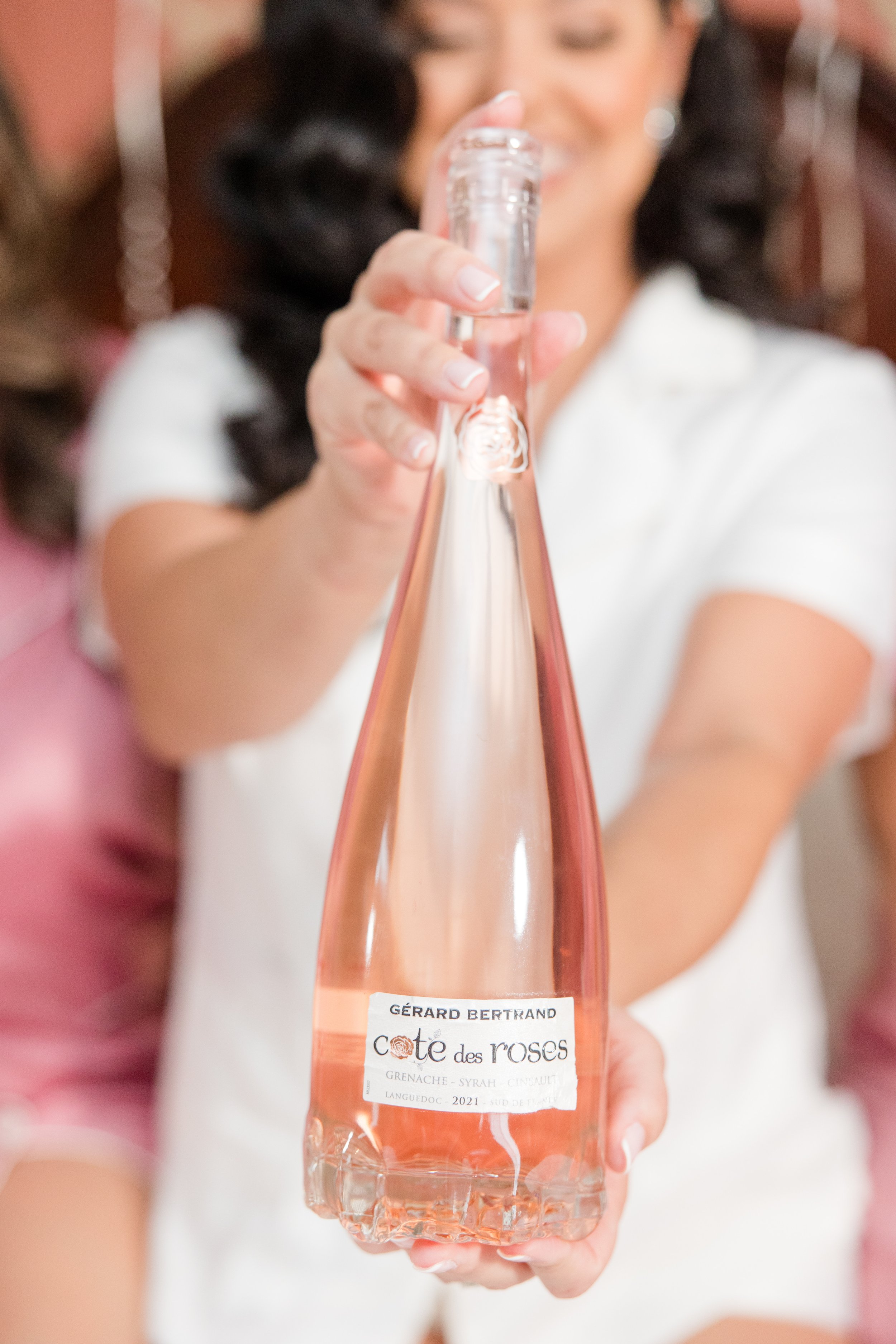 Bride holding pink champagne in PJs. Getting ready photo by NJ wedding photographer, Jessica Anne Photography