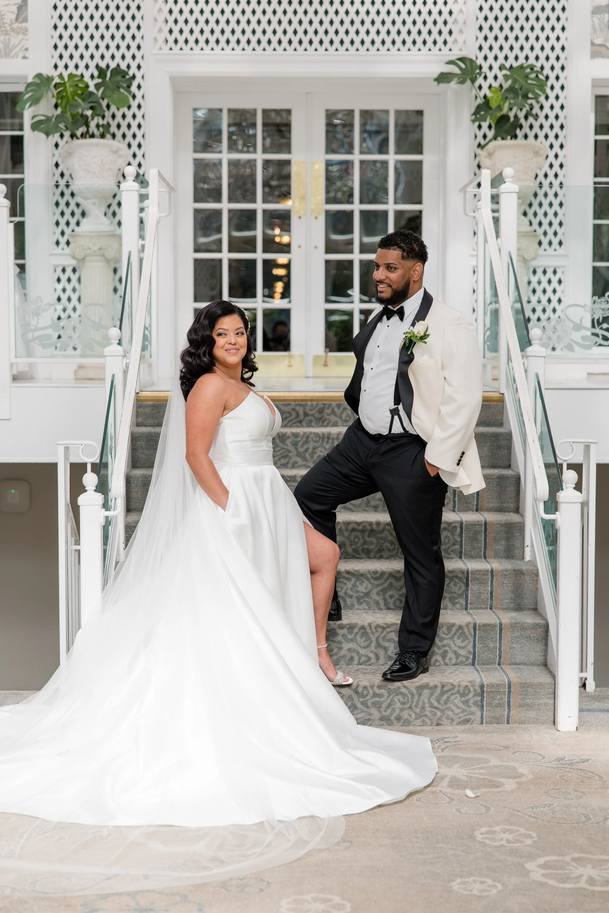Editorial wedding photo of bride and groom on stairs at The Park Savoy Estate in Florham Park, NJ. Shot by Jessica Anne Photography
