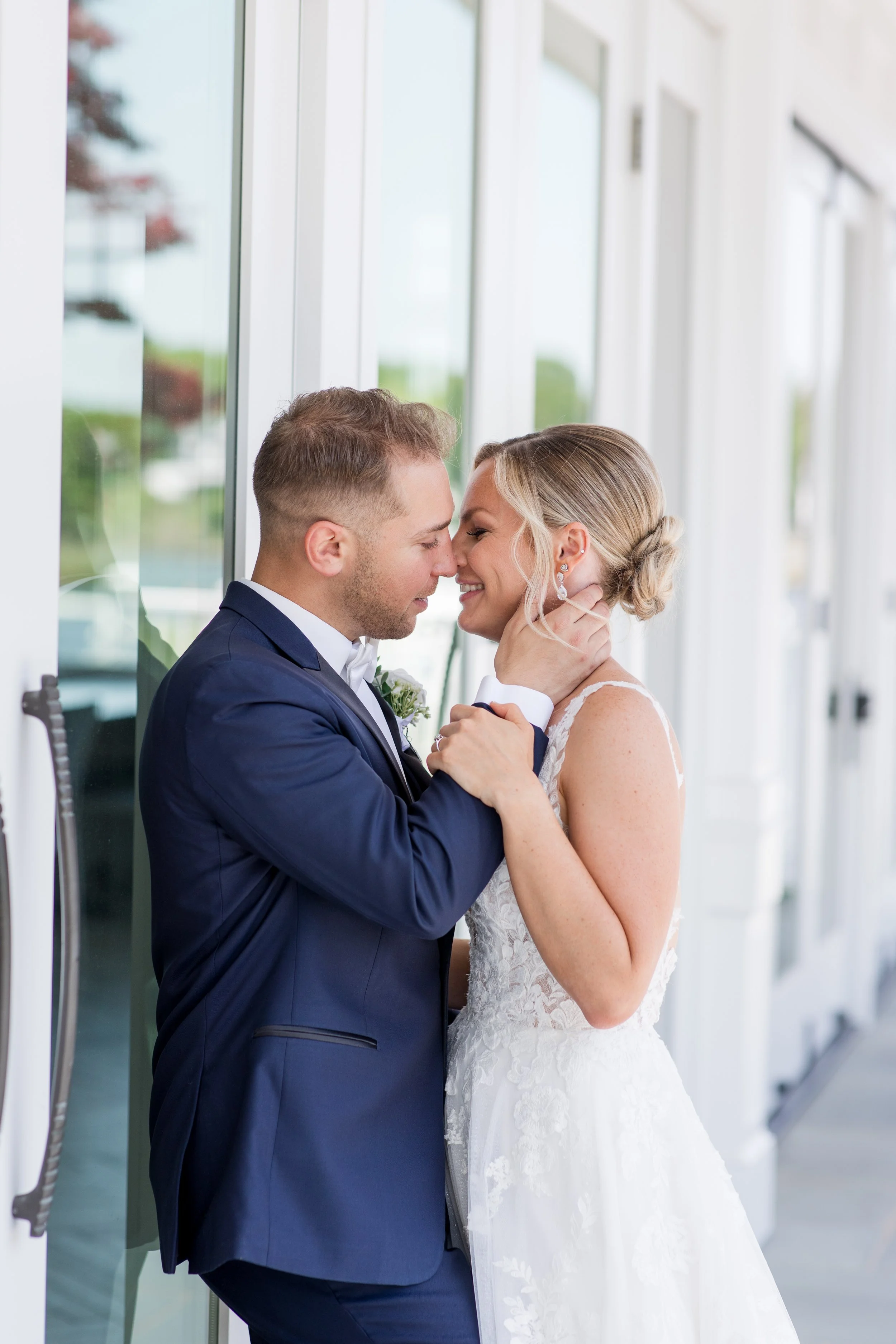 Intimate bride and groom kiss wedding photo at Crystal Point Yacht Club in Point Pleasant, NJ. Photo by Jessica Anne Photography
