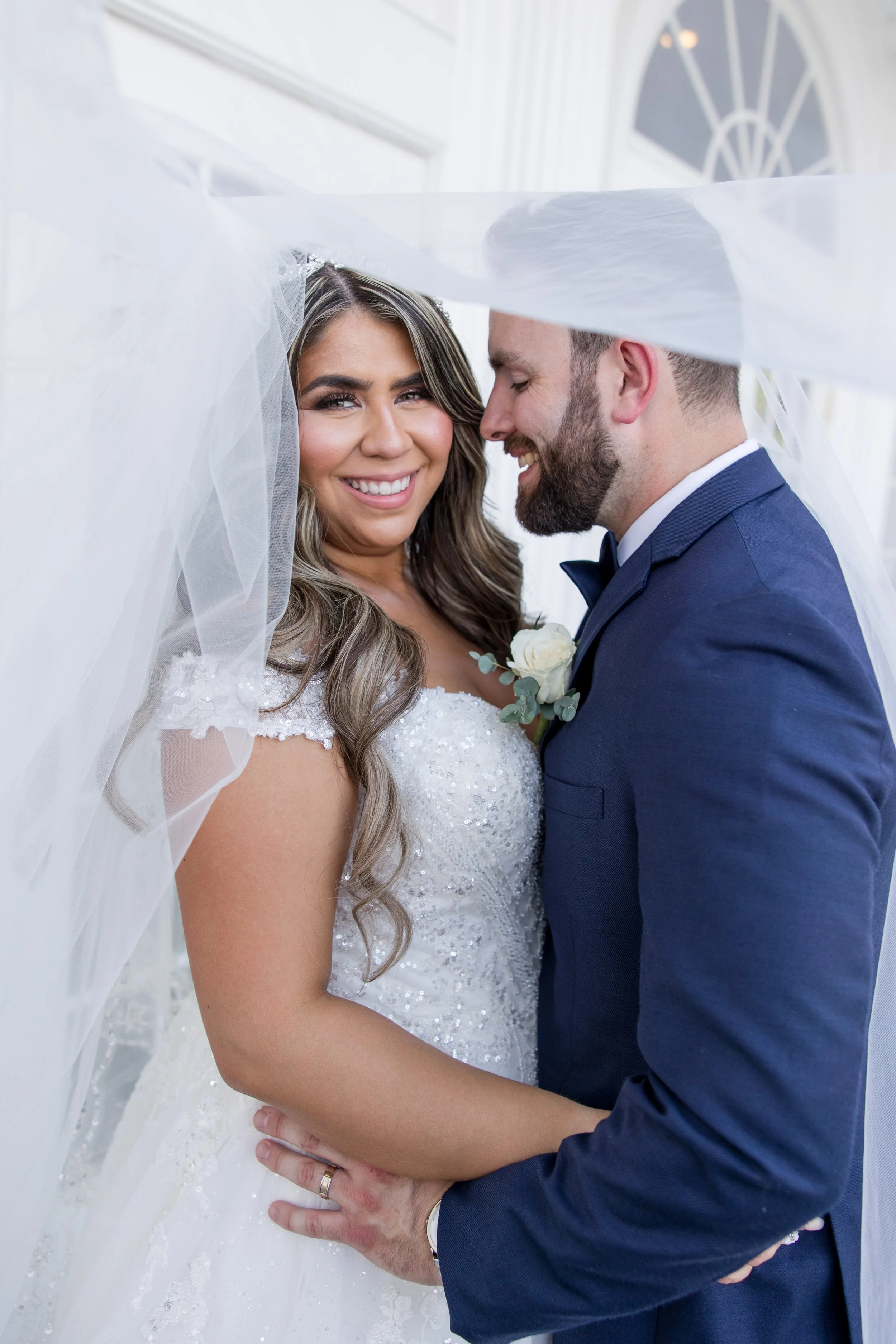 Intimate veil framing bride and groom photo. Taken at The Park Savoy Estate in Florham Park, NJ by Jessica Anne Photography