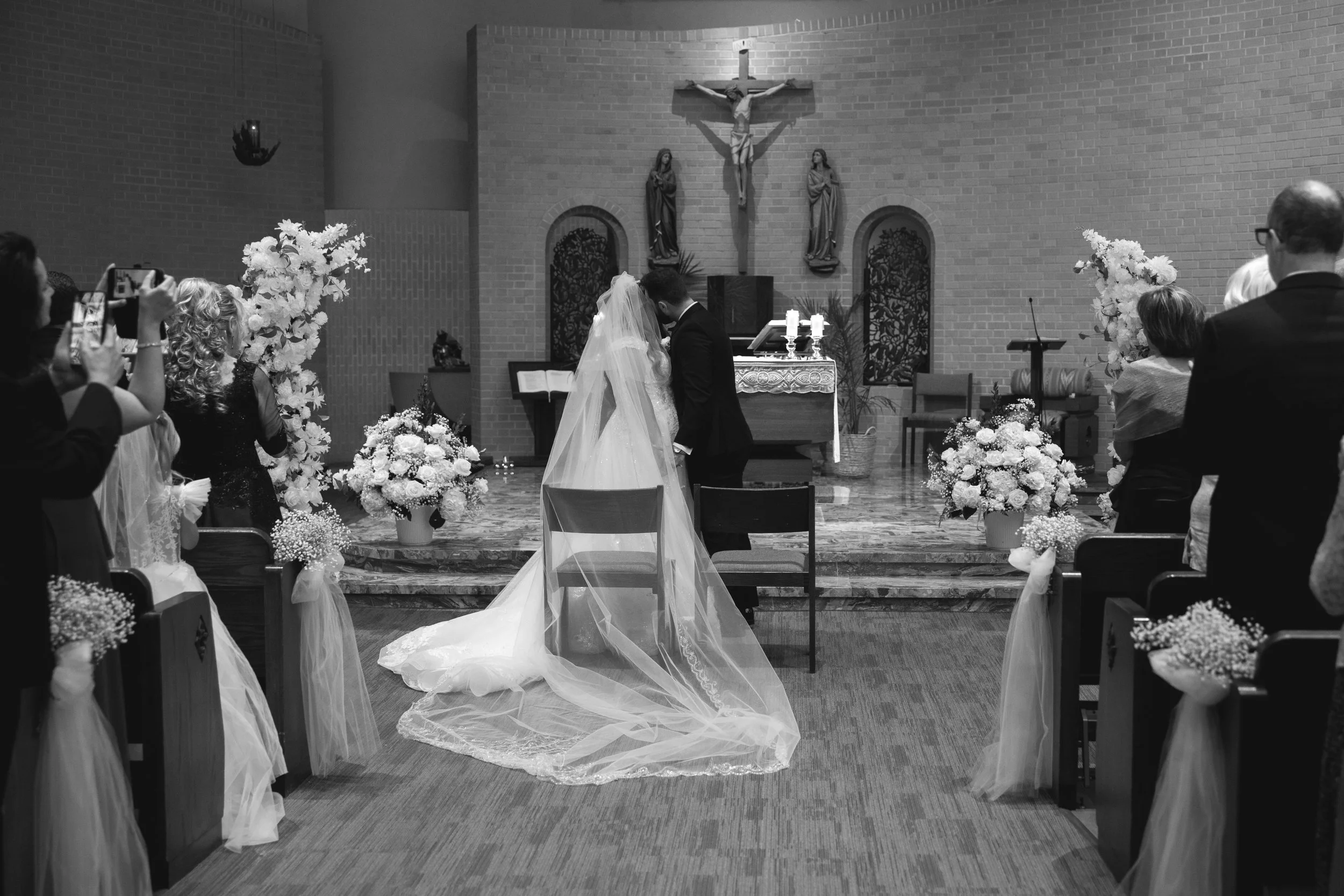 Bride and groom first kiss photo from church ceremony by NJ photographer, Jessica Anne Photography