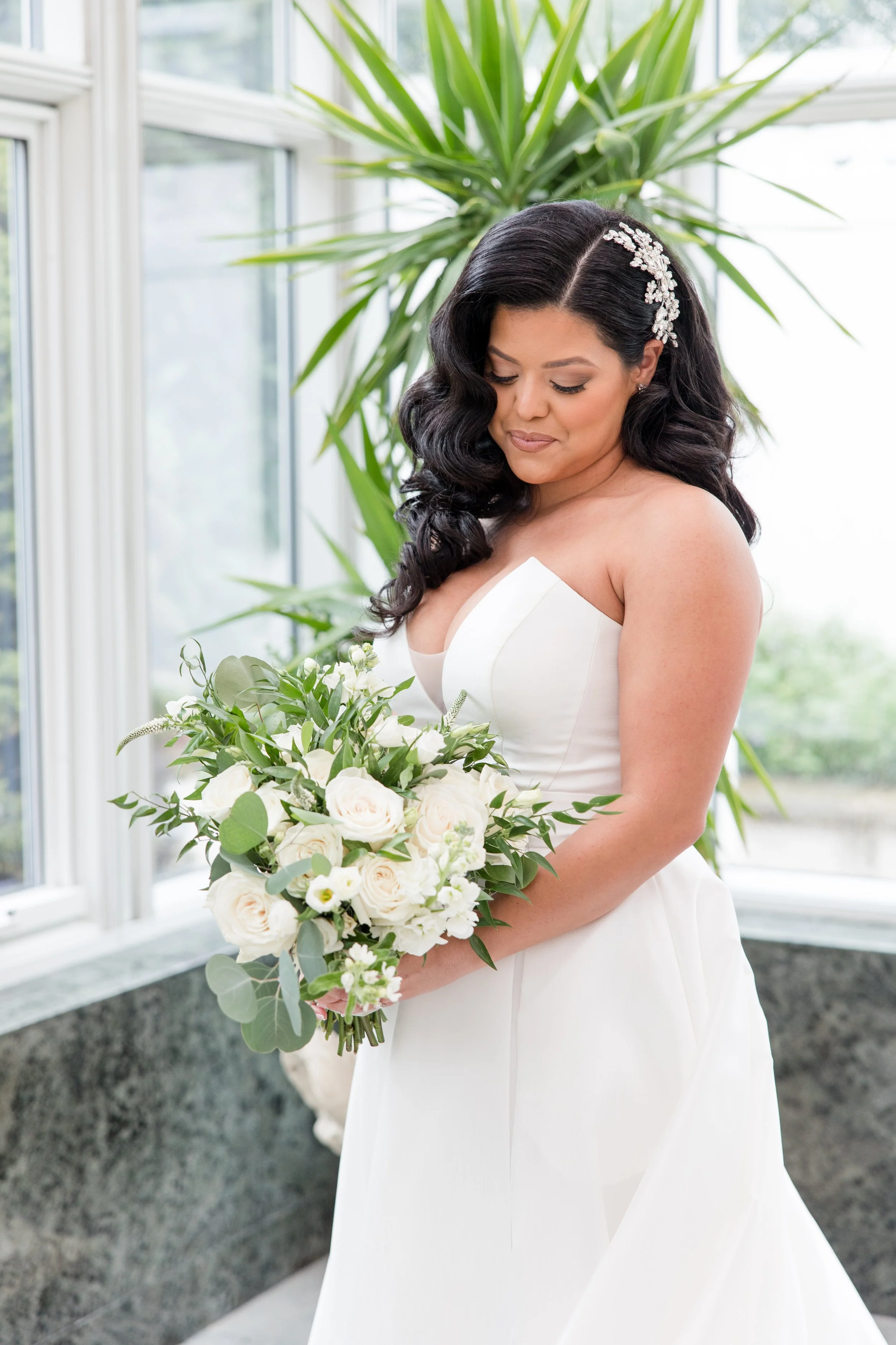 Bride solo shot with bouquet in greenhouse at The Park Savoy Estate in Florham Park, NJ. Shot by Jessica Anne Photography