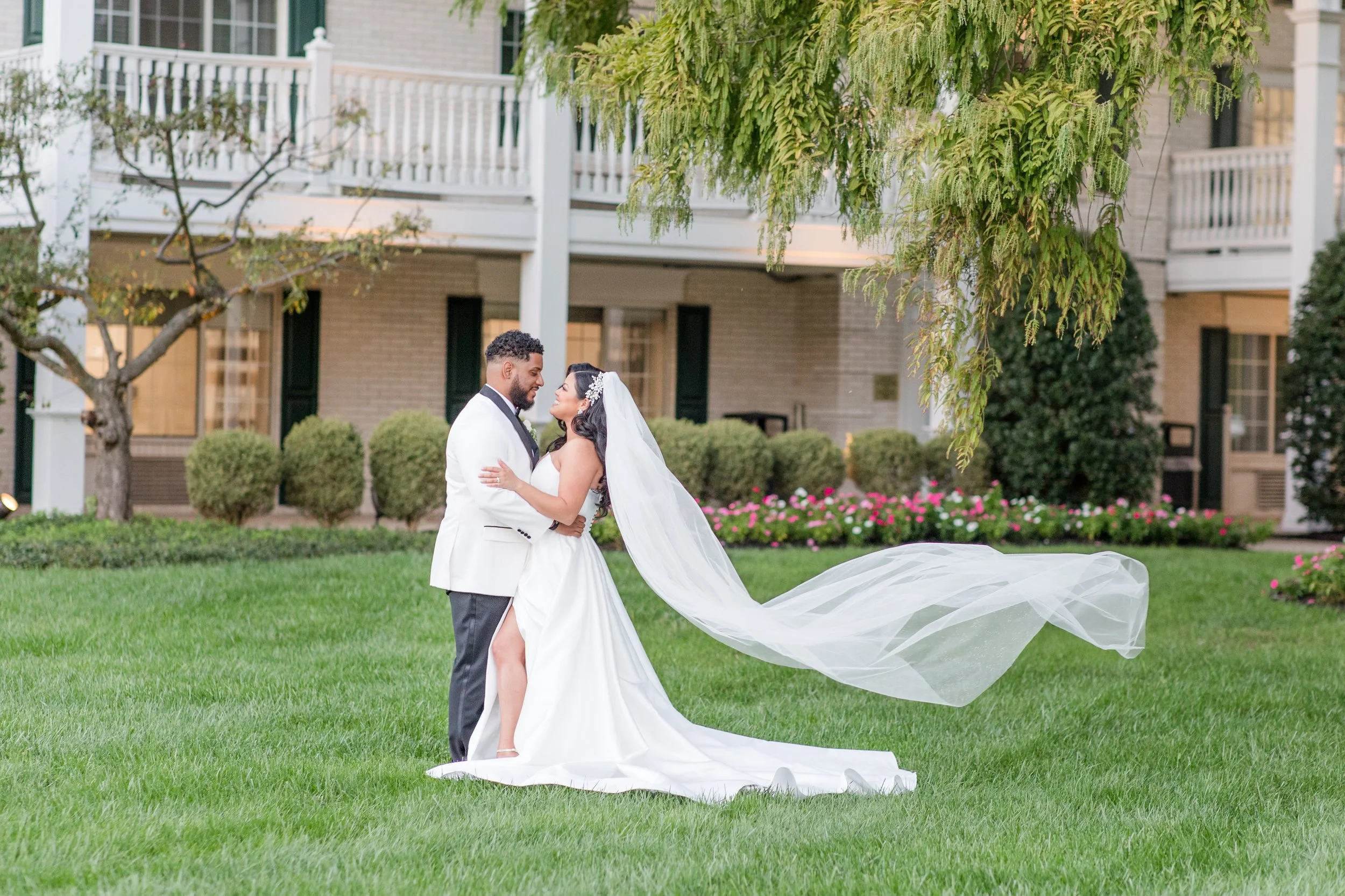 Veil blowing in wind bride and groom photo at The Park Savoy Estate in Florham Park, NJ by Jessica Anne Photography, New Jersey Wedding photographer