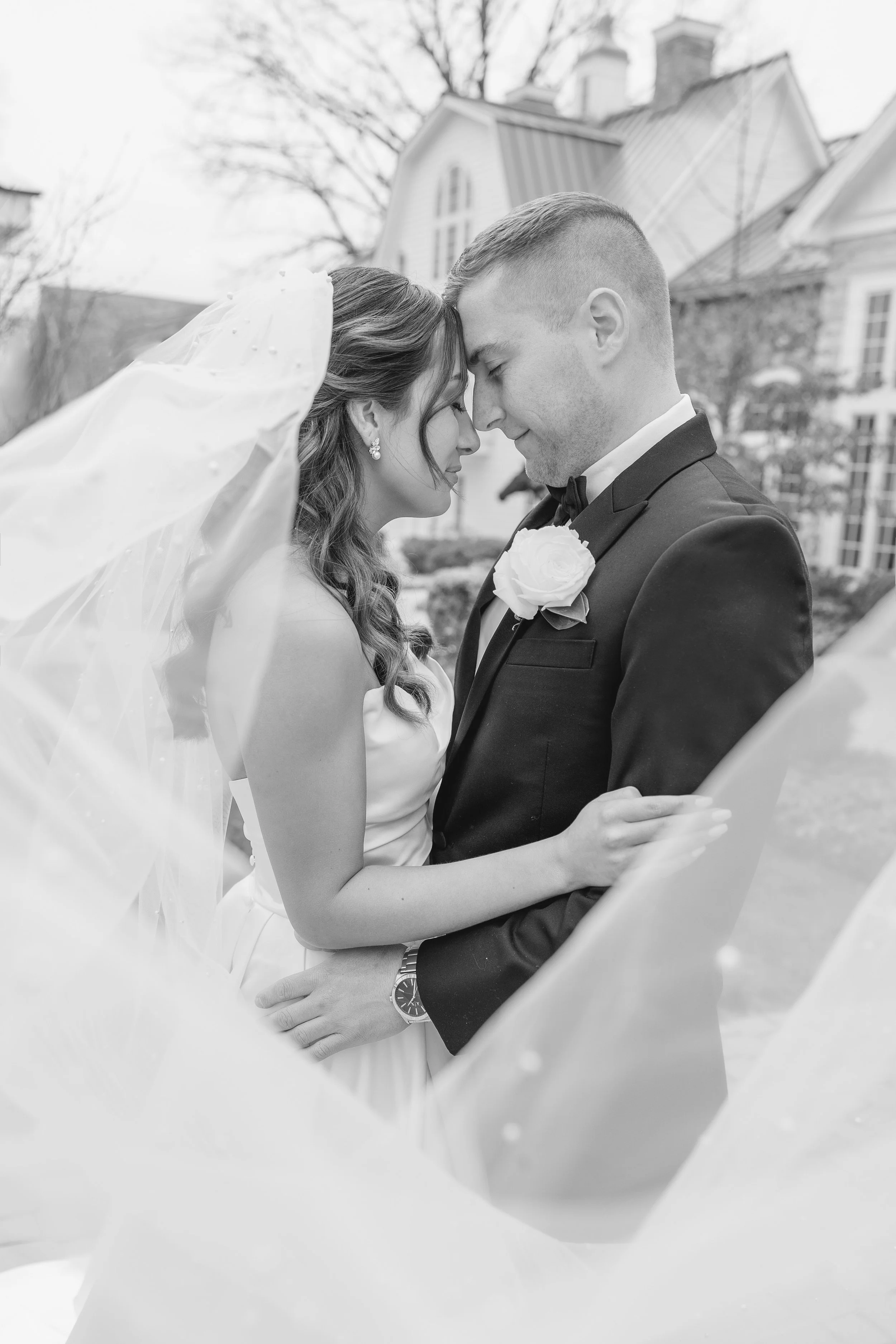 Swooping veil framing the bride and groom wedding photo by Jessica Anne Photography at the Ryland Inn in White House Station, NJ 