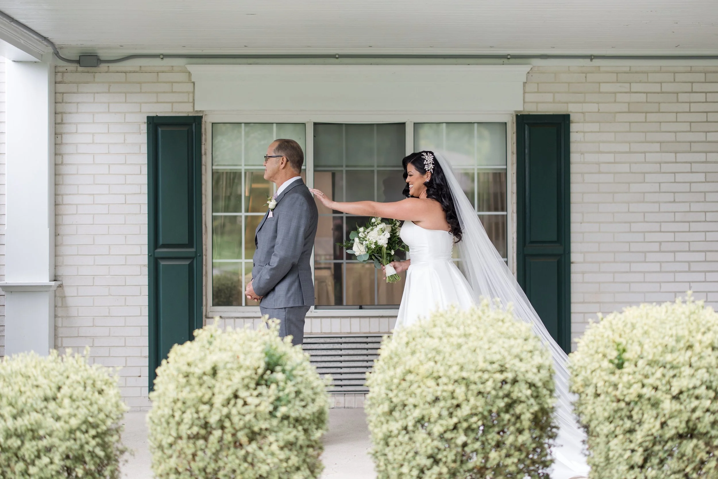Bride tapping father's shoulder in first look photo by Jessica Anne Photography. Taken at The Park Savoy Estate in Florham Park, NJ