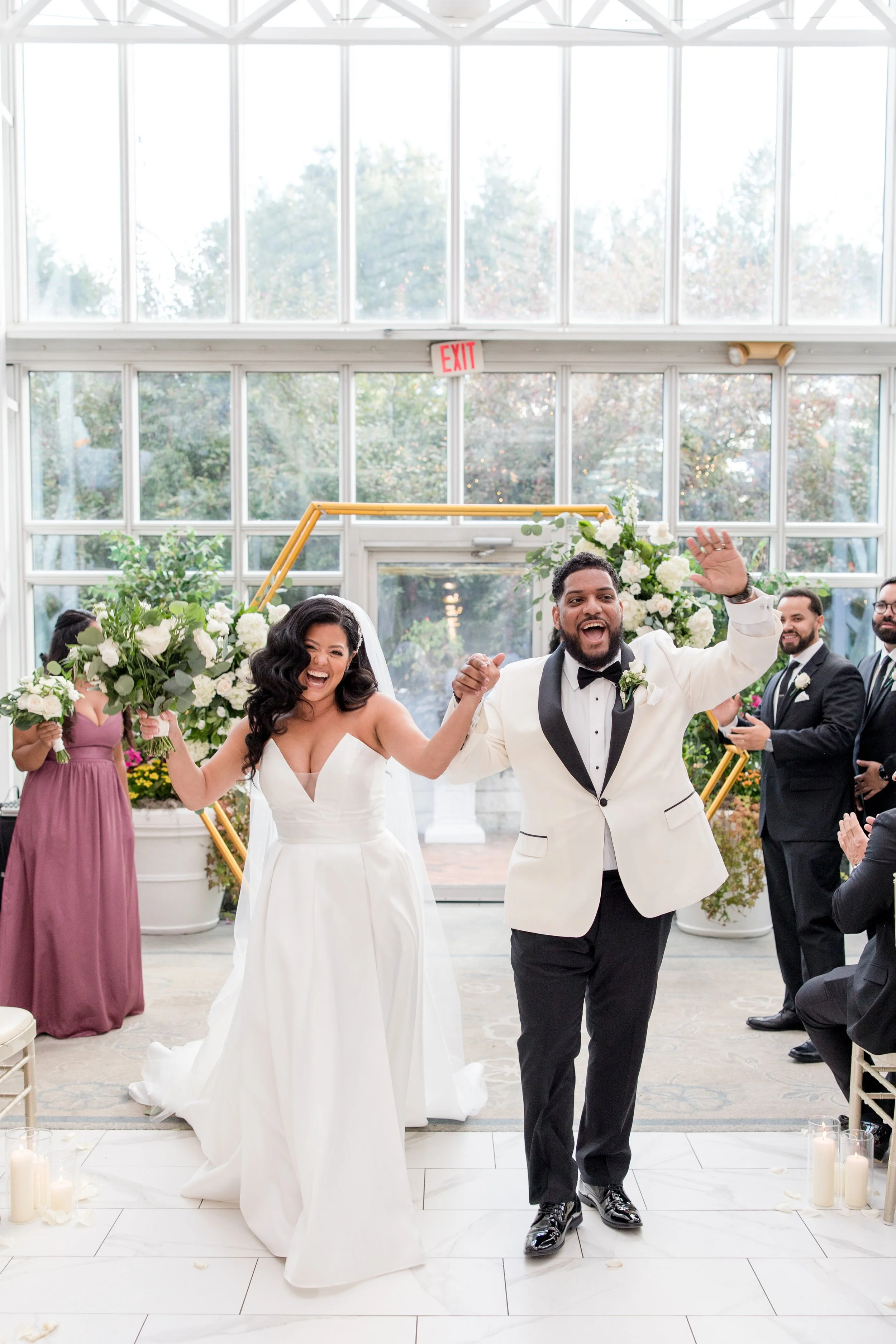 Just married bride and groom dancing down the aisle greenhouse wedding at The Park Savoy Estate in Florham Park, NJ. Shot by Jessica Anne Photography