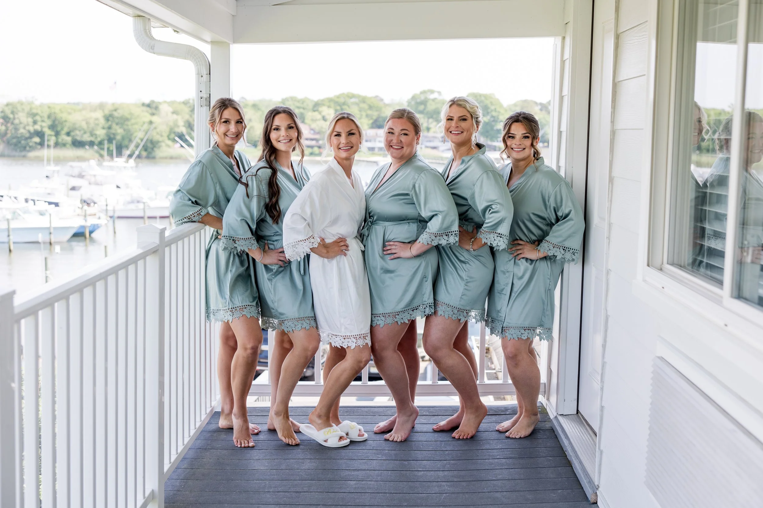 Bridesmaids bath robe photo on the water at Crystal Point Yacht Club in Point Pleasant, NJ by Jessica Anne Photography