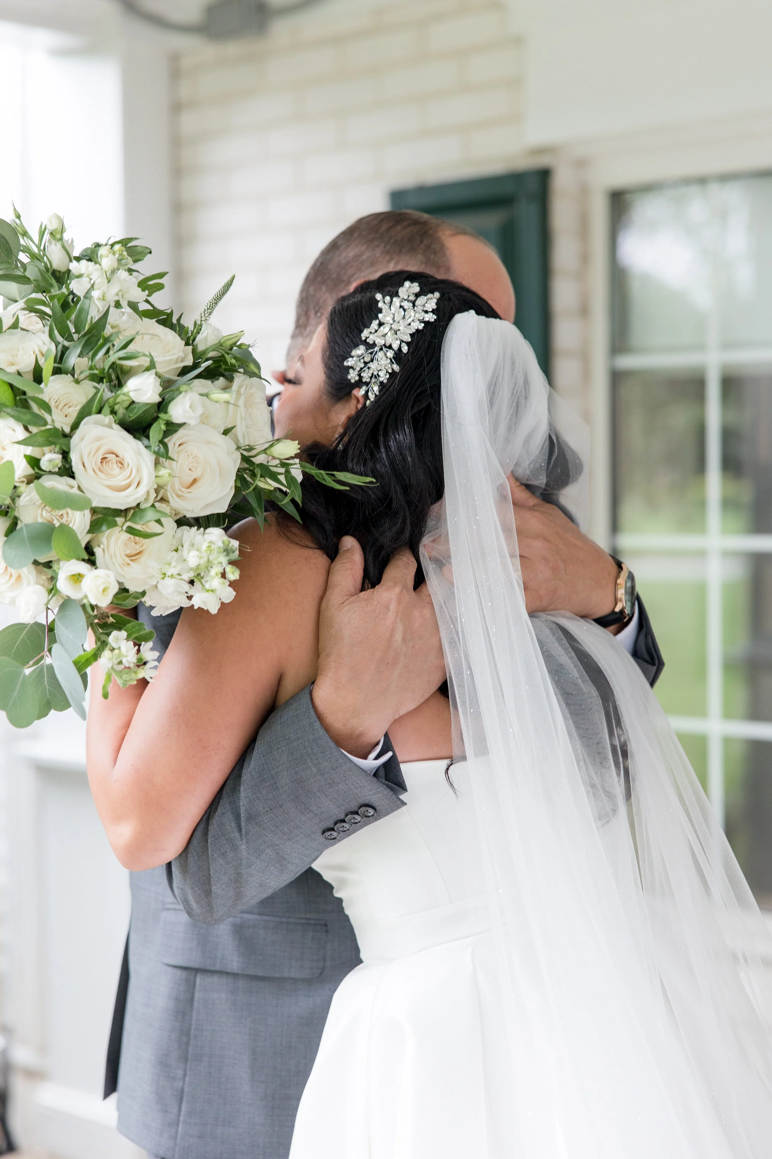 Bride and father hugging in first look photo by Jessica Anne Photography. Taken at The Park Savoy Estate in Florham Park, NJ