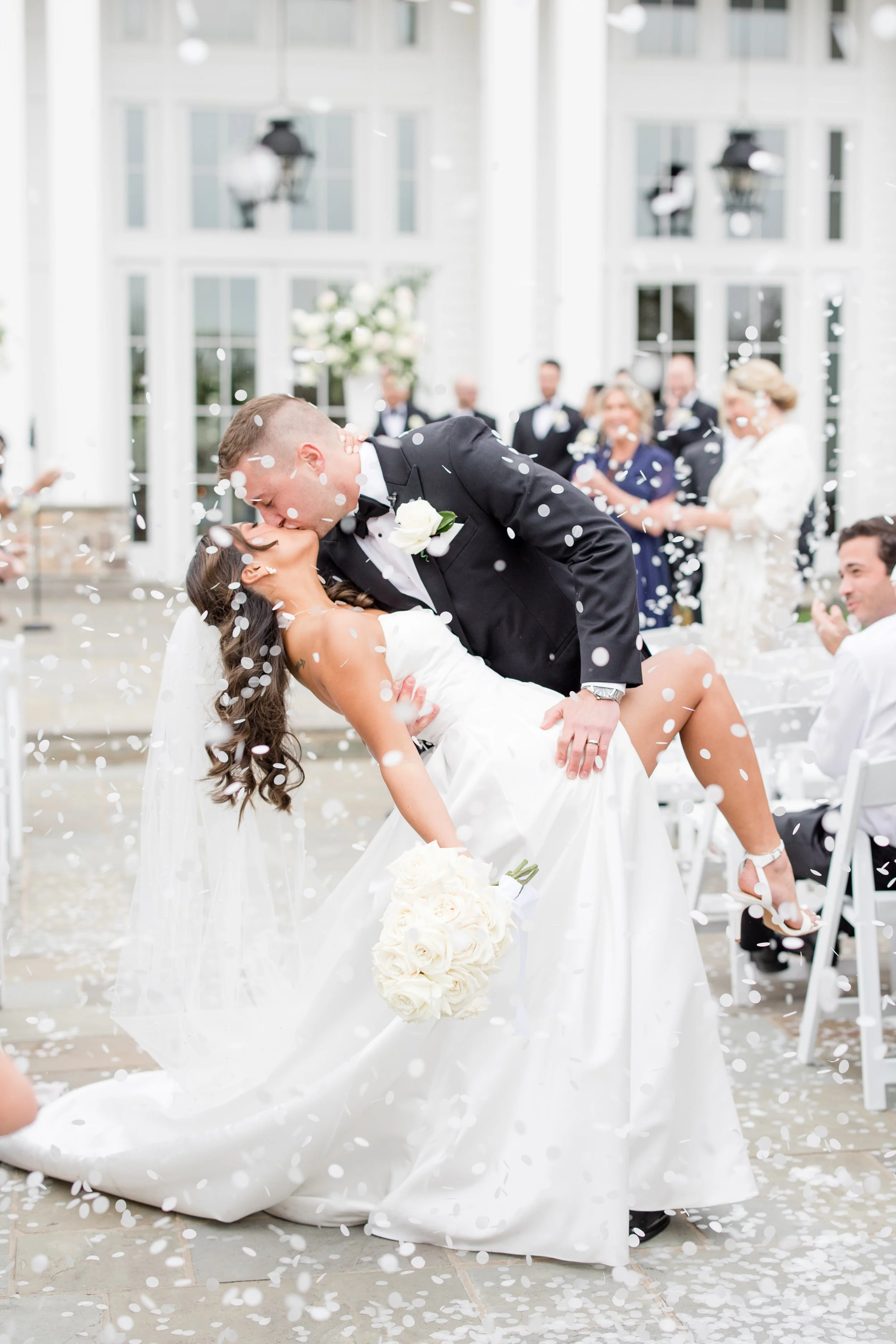 Groom dipping bride first kiss ceremony photo. Captured by Jessica Anne Photography at the Ryland Inn in White House Station, NJ