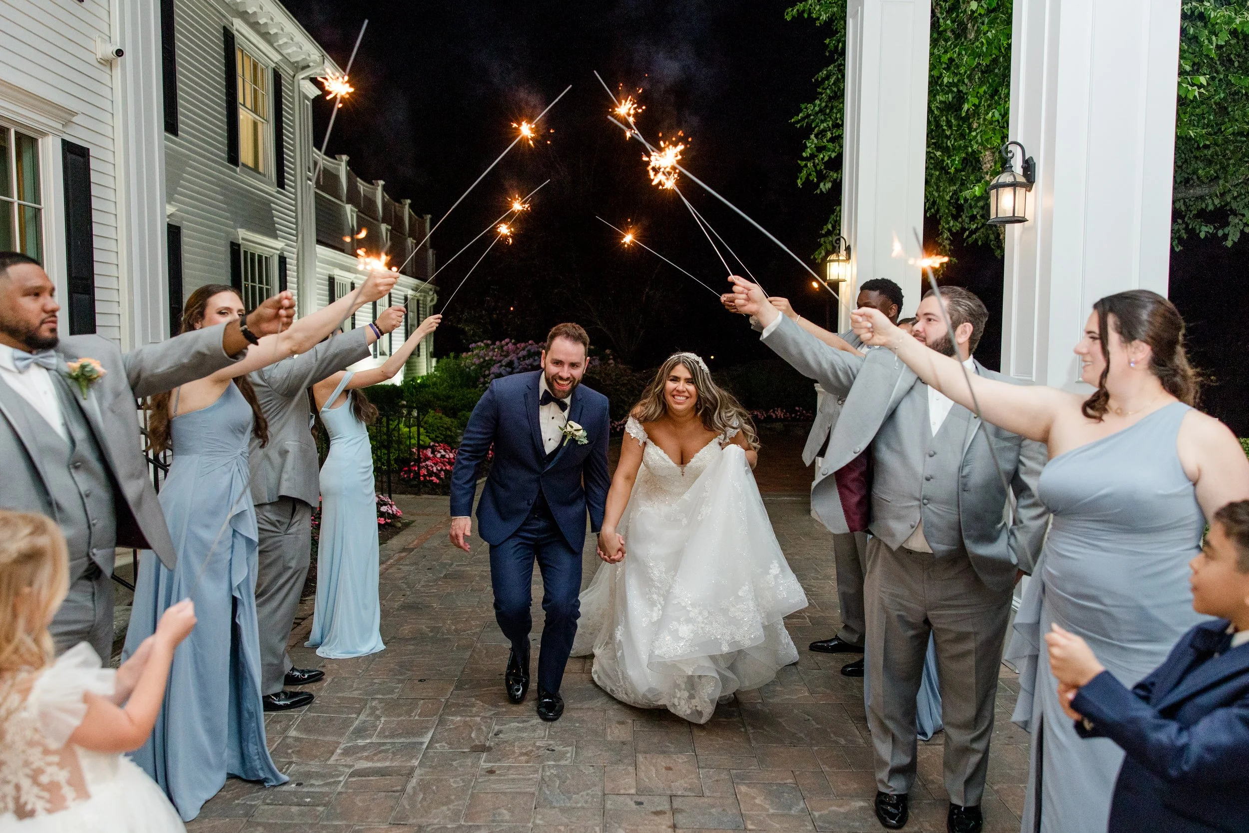 Bride and groom running under sparklers at The Park Savoy Estate in Florham Park, NJ by Jessica Anne Photography