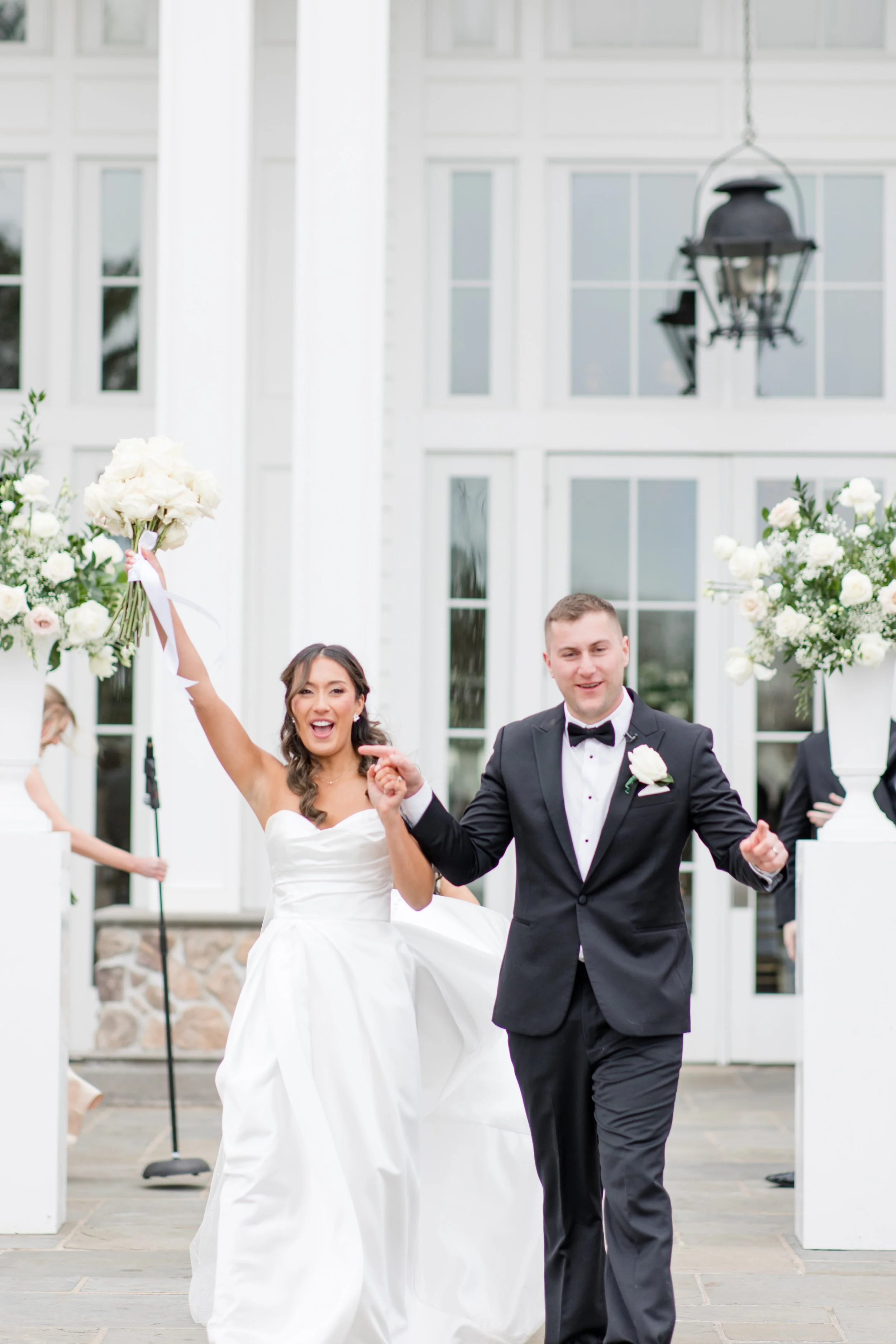 Cheering bride and groom walking down the aisle just married wedding photo by Jessica Anne Photography at the Ryland Inn in White House Station, NJ