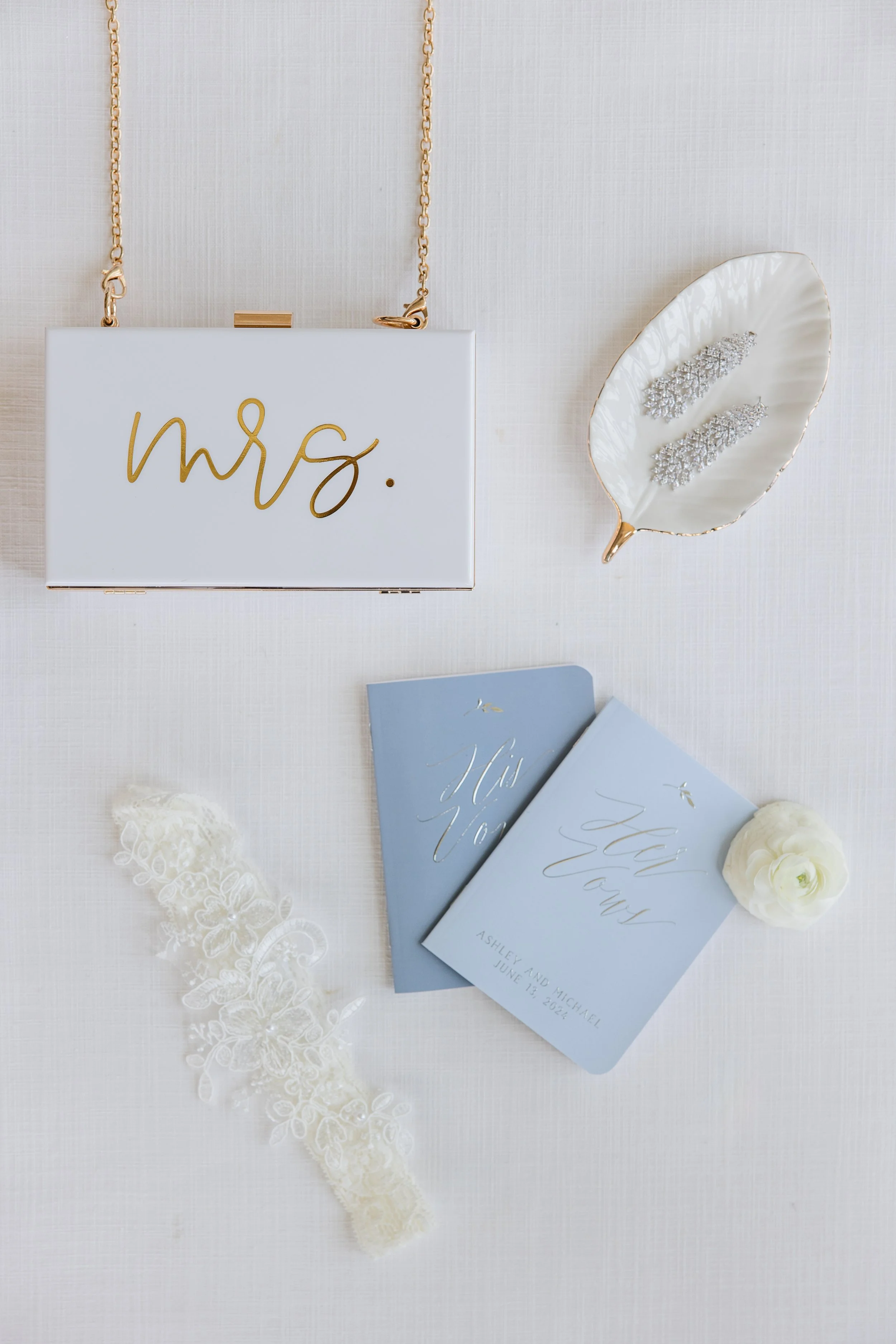Mrs. purse, hair clips, vows books, and garter - Bride accessories photo by NJ wedding photographer, Jessica Anne Photography