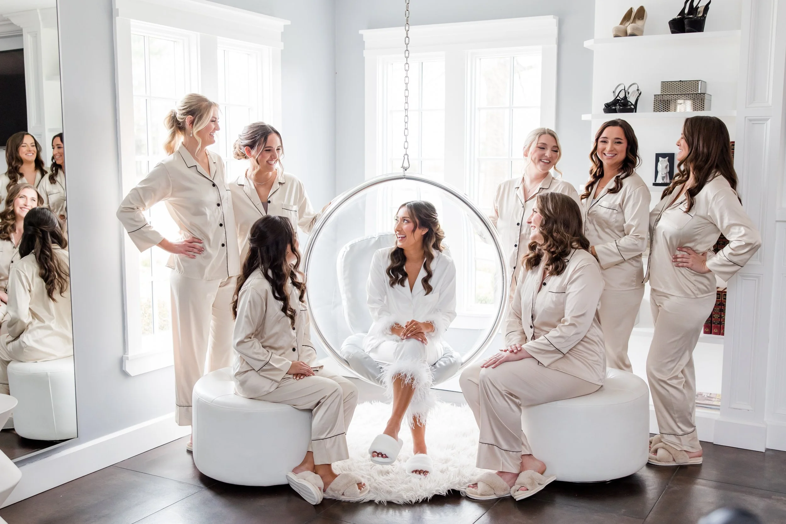 Bride with bridesmaids in matching pajamas. Wedding getting ready photo at the Ryland Inn in White House Station, NJ by Jessica Anne Photography