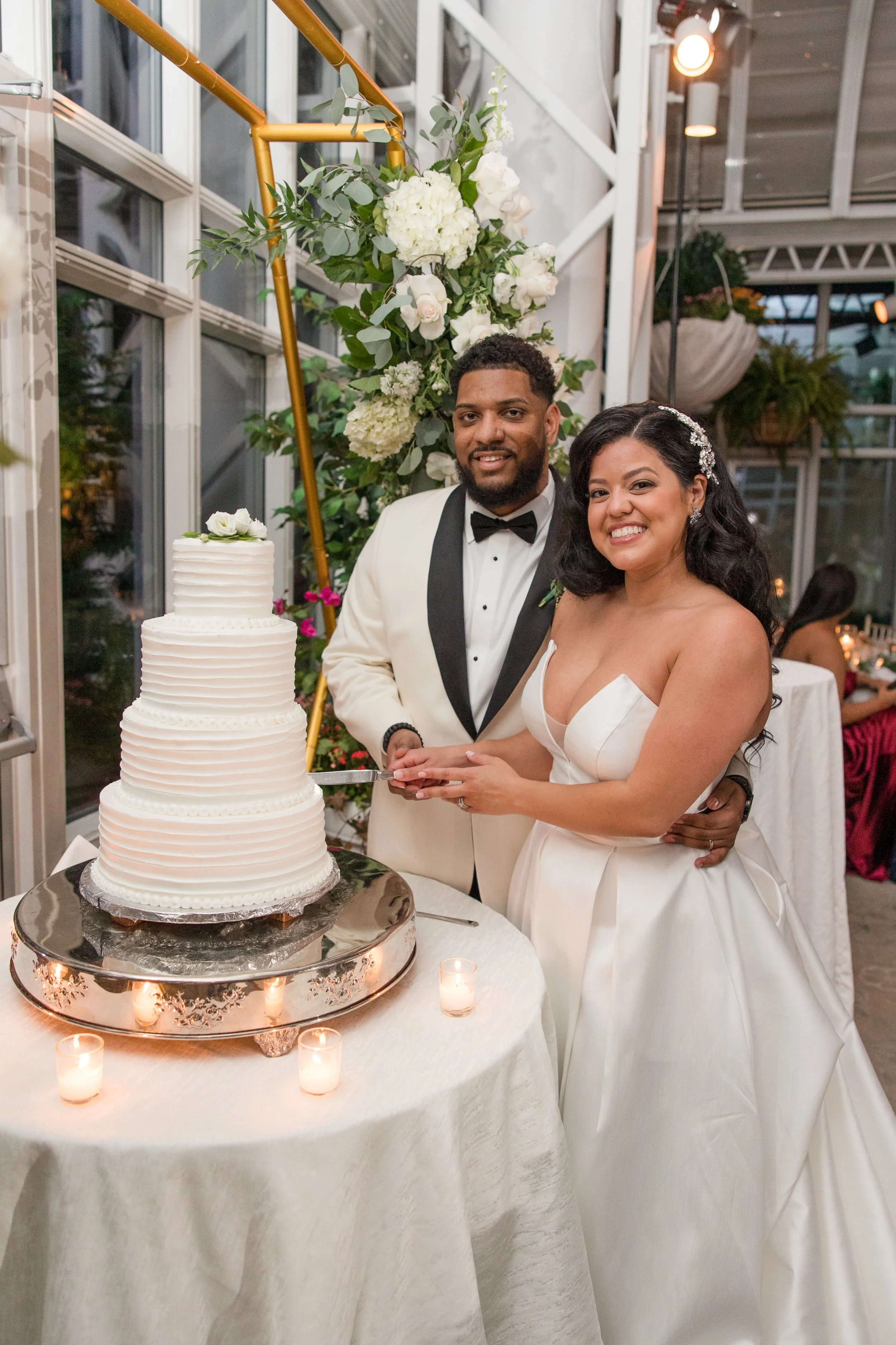 Smiling bride and groom cake cutting photo. Taken at The Park Savoy Estate in Florham Park, NJ by Jessica Anne Photography