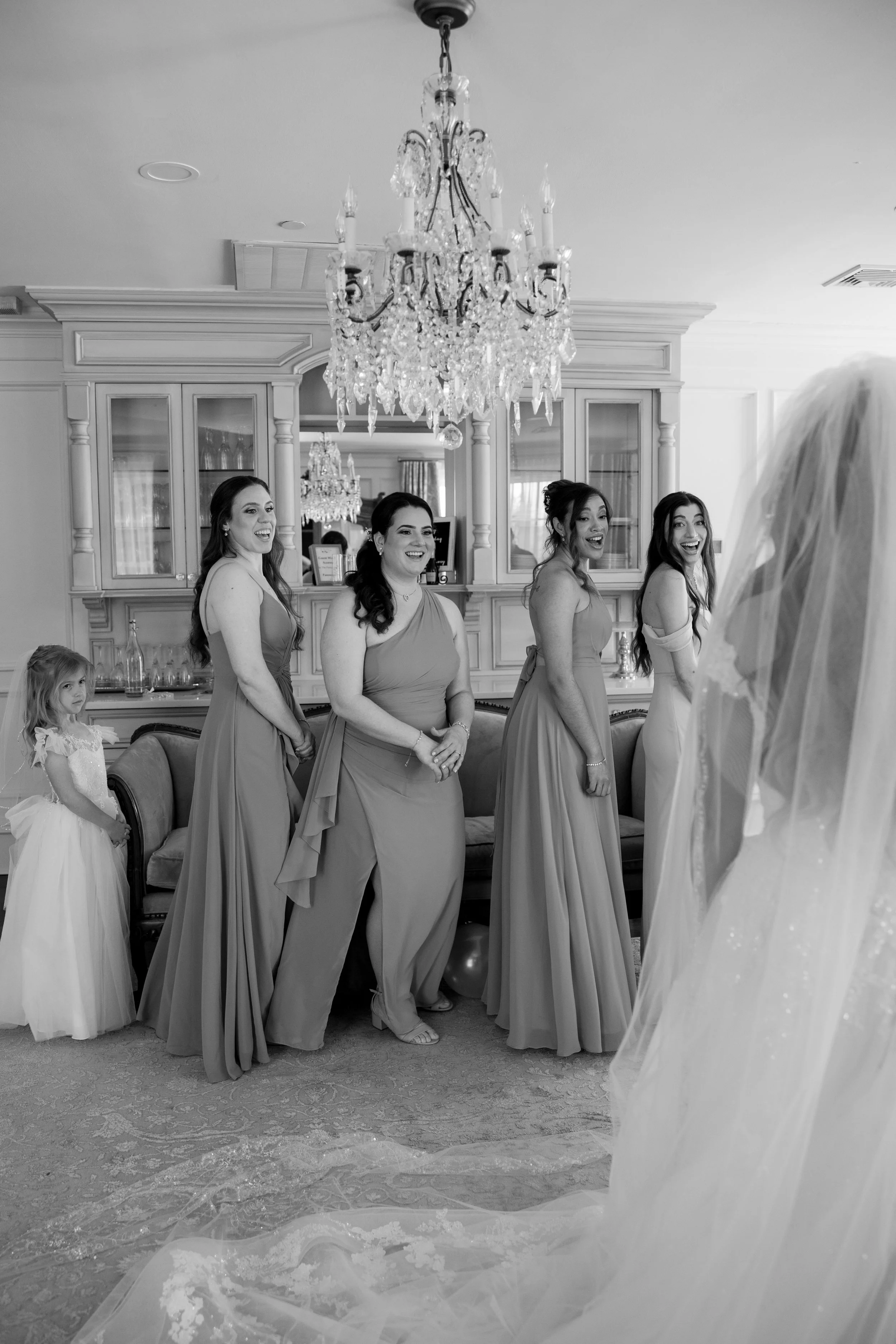 Bridesmaids first look photo with bride at The Park Savoy Estate in Florham Park, NJ by wedding photographer, Jessica Anne Photography