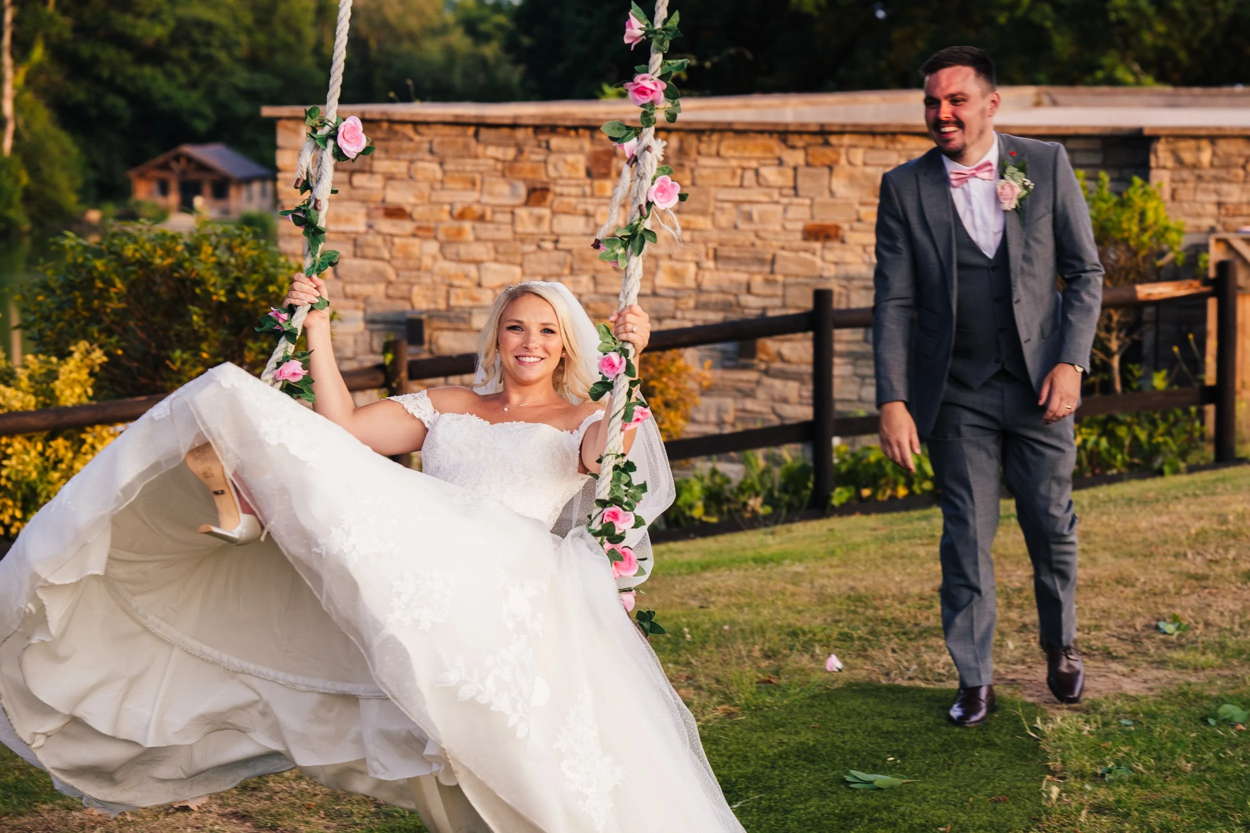 groom-pushing-bride-on-swing.jpg