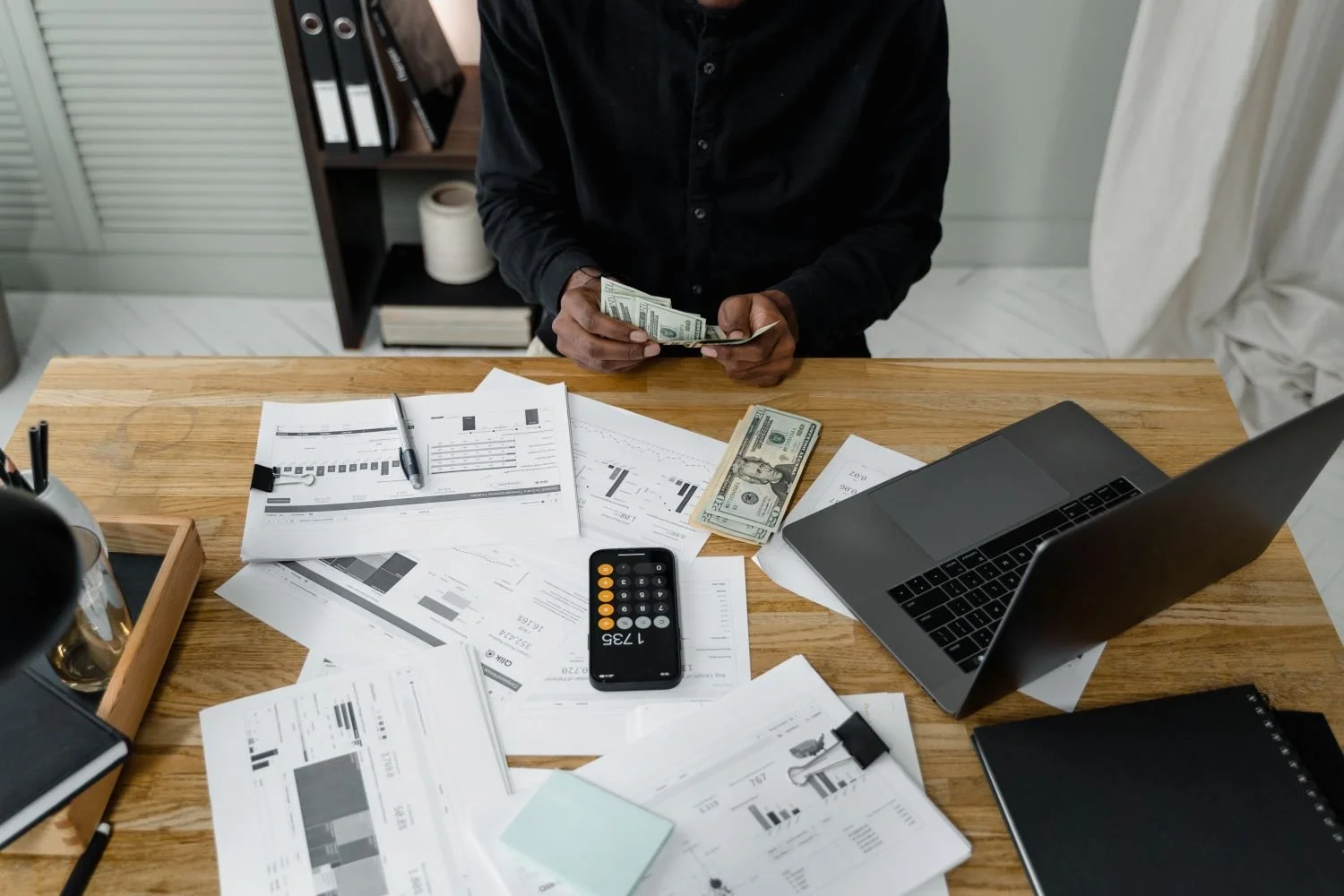 desk-man-count-money (resized).jpg