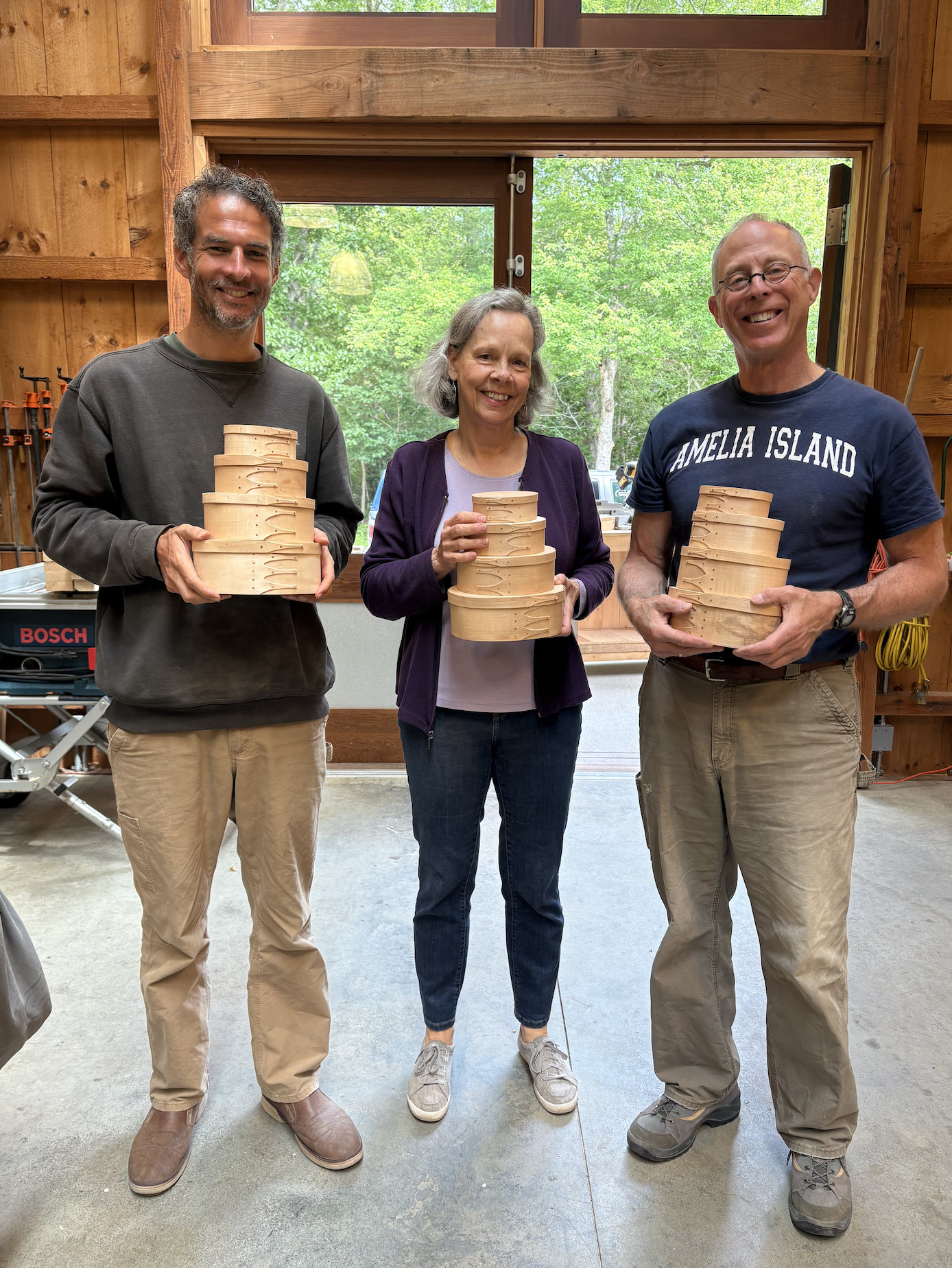 Three students at the Shaker boxes woodworking class
