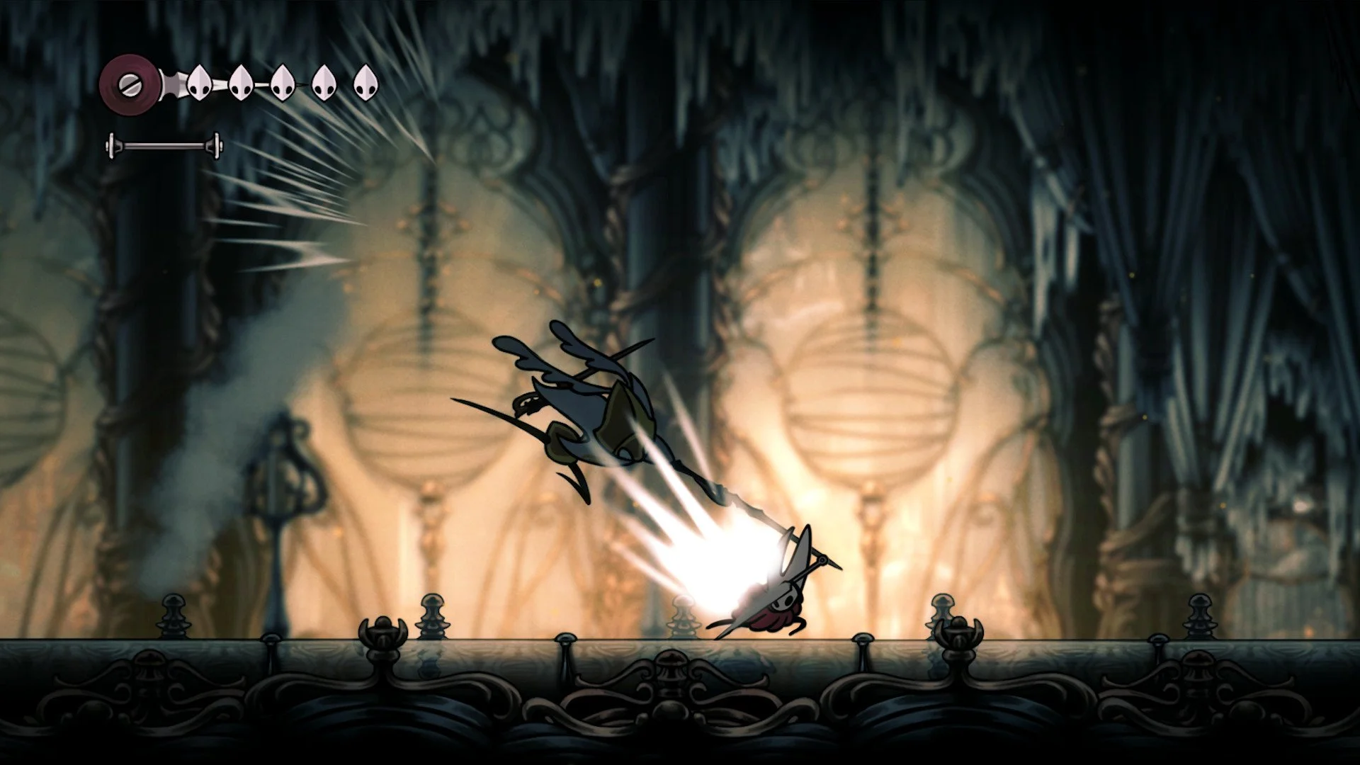 Hornet blocks a downward needle strike form an enemy in Silksong. The scene features glowing amber pillars and intricate, dark cavern architecture.