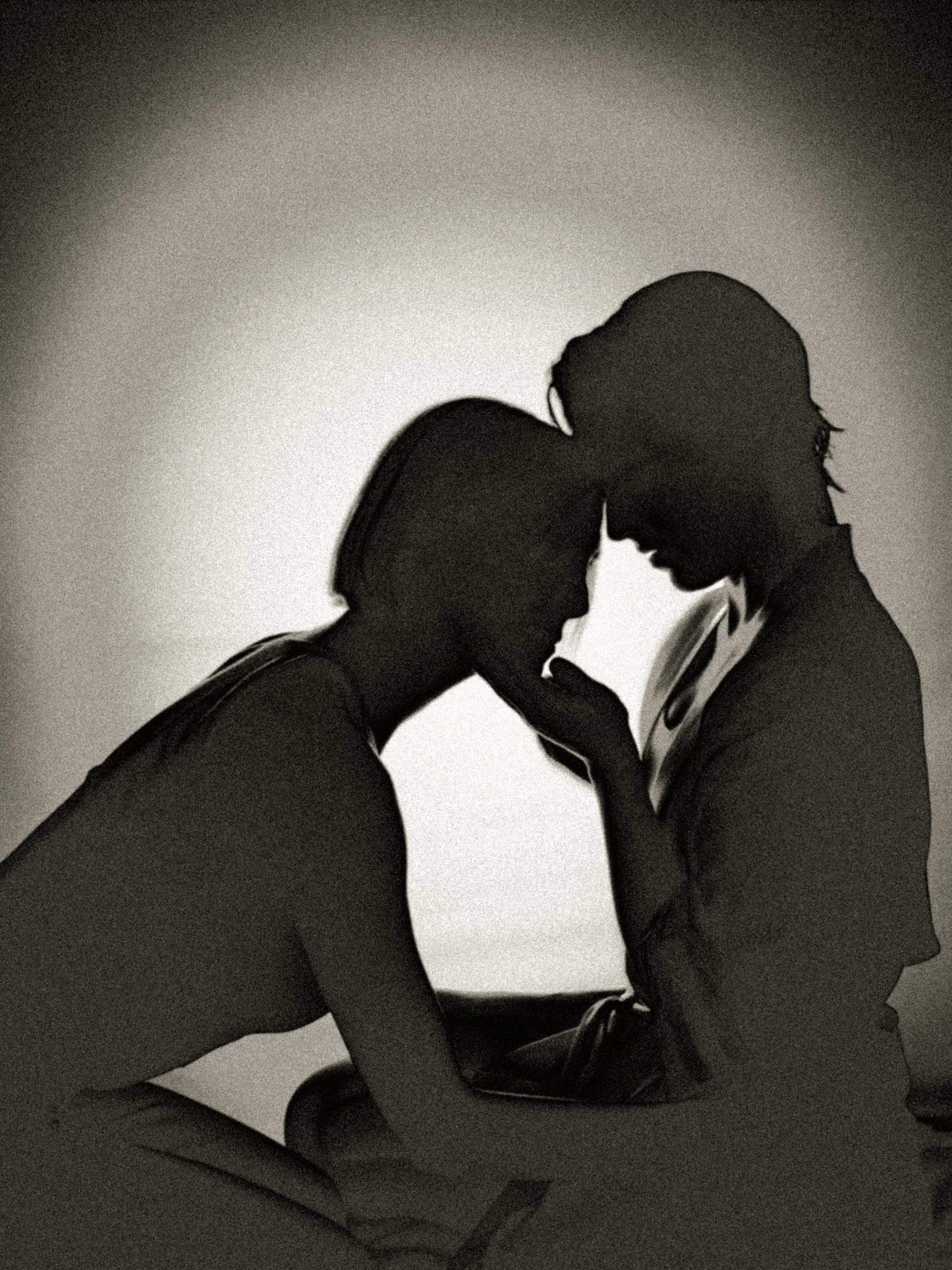 Minimalist black-and-white silhouette of two figures leaning forehead-to-forehead, emphasizing tenderness, union, and quiet emotional gravity.
