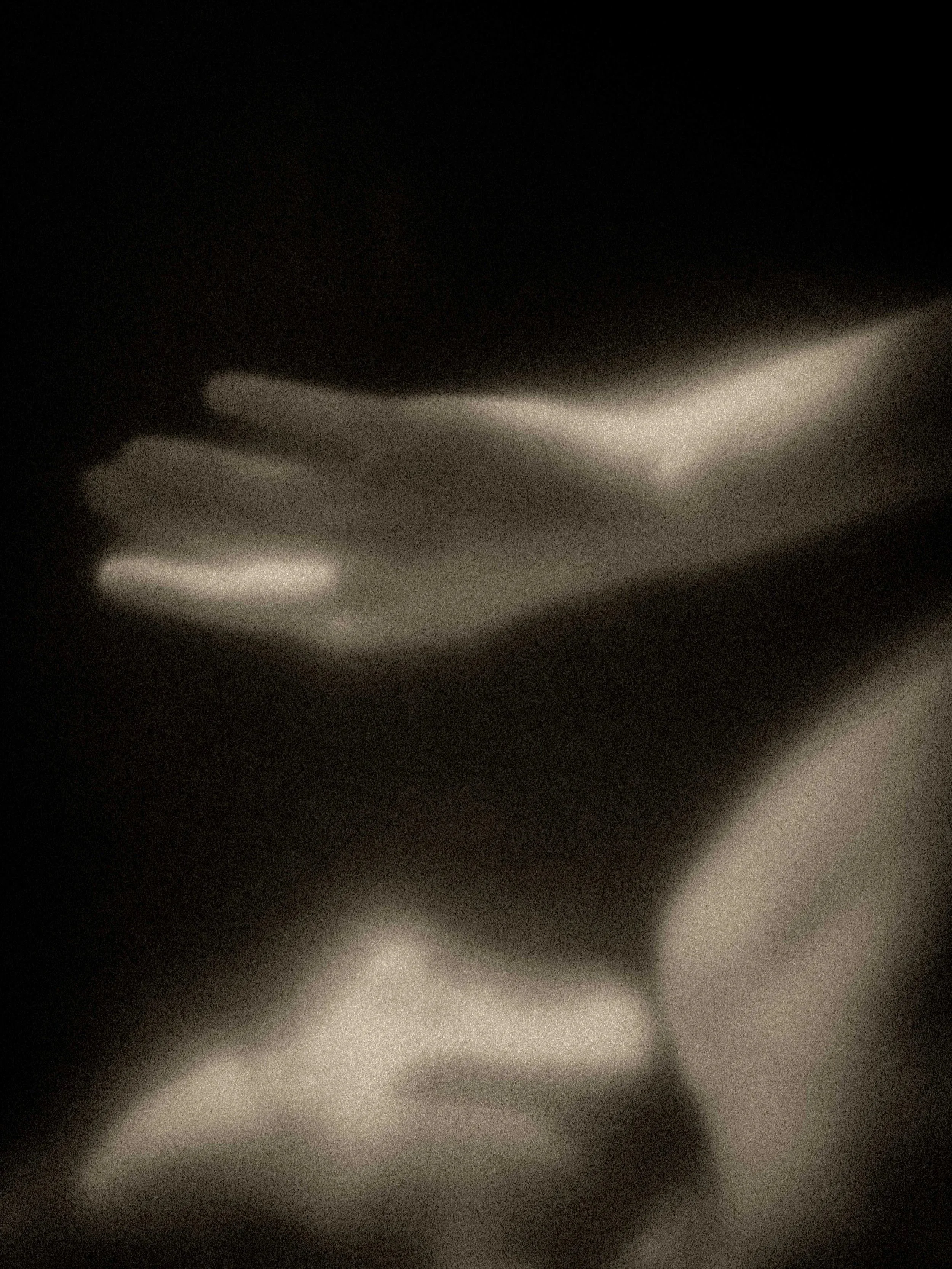 Dreamlike monochrome portrait with a luminous outline tracing a reclining face—an abstract fine art photograph evoking sleep, memory, and the shifting boundary between self and shadow.