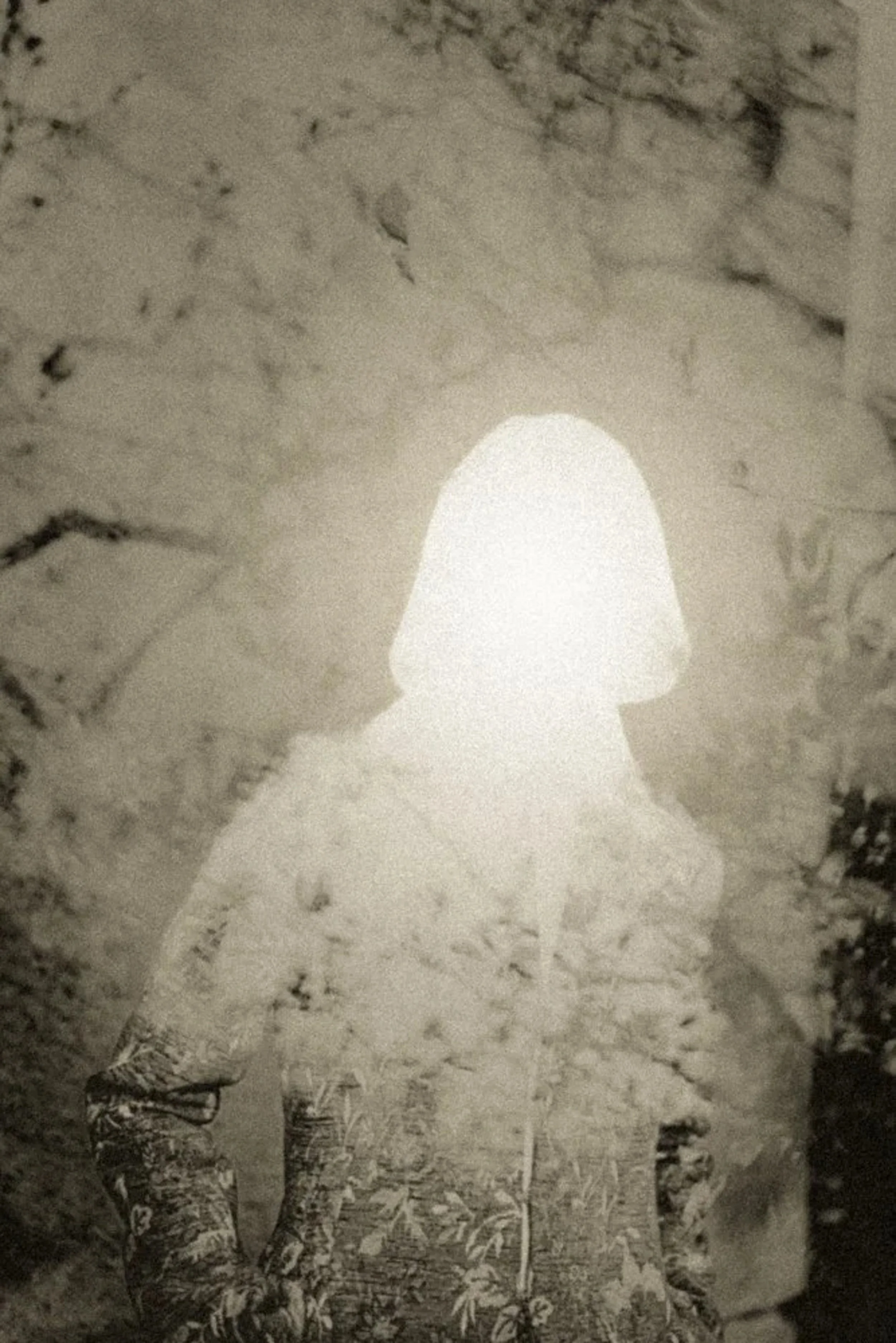 Surreal monochrome portrait collage of a faceless figure with a glowing white head and layered textures, contemporary conceptual fine art photography.