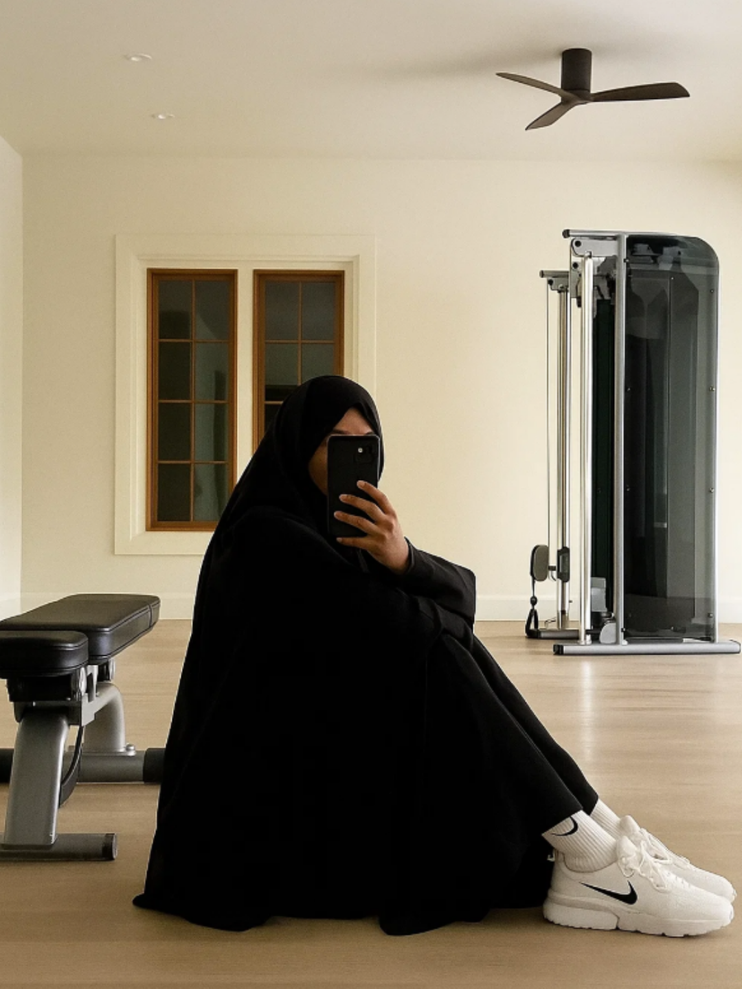 Muslim woman in home gym
