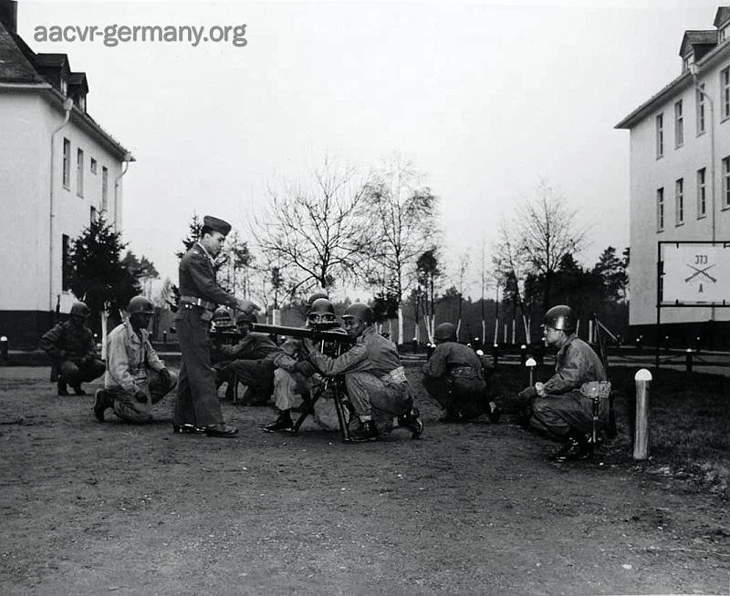 Member of Company “A” 373rd Infantry Battalion get training in the use of the 57 mm recoilless rifle in a class conducted by 1st Lt. Gilbert Boothe. Giessen, Germany, December 14, 1948 (LOC).