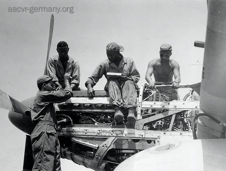 Mechanics of the 332nd Fighter Group of the 15th AAF: S/Sgt Calvin P. Thierry, S/Sgt William e. Pitts, S/Sgt Vernon C. Richardson, S/Sgt Harold t. Cobb. Italy, August 2, 1944 (NARA).