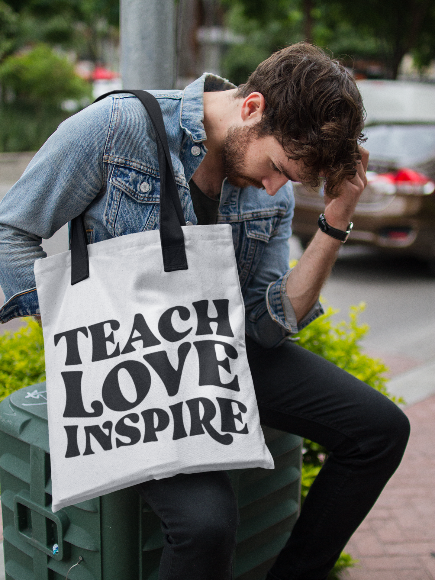 man-carrying-a-tote-bag-mockup-while-looking-to-the-floor-in-the-street-a17092.png
