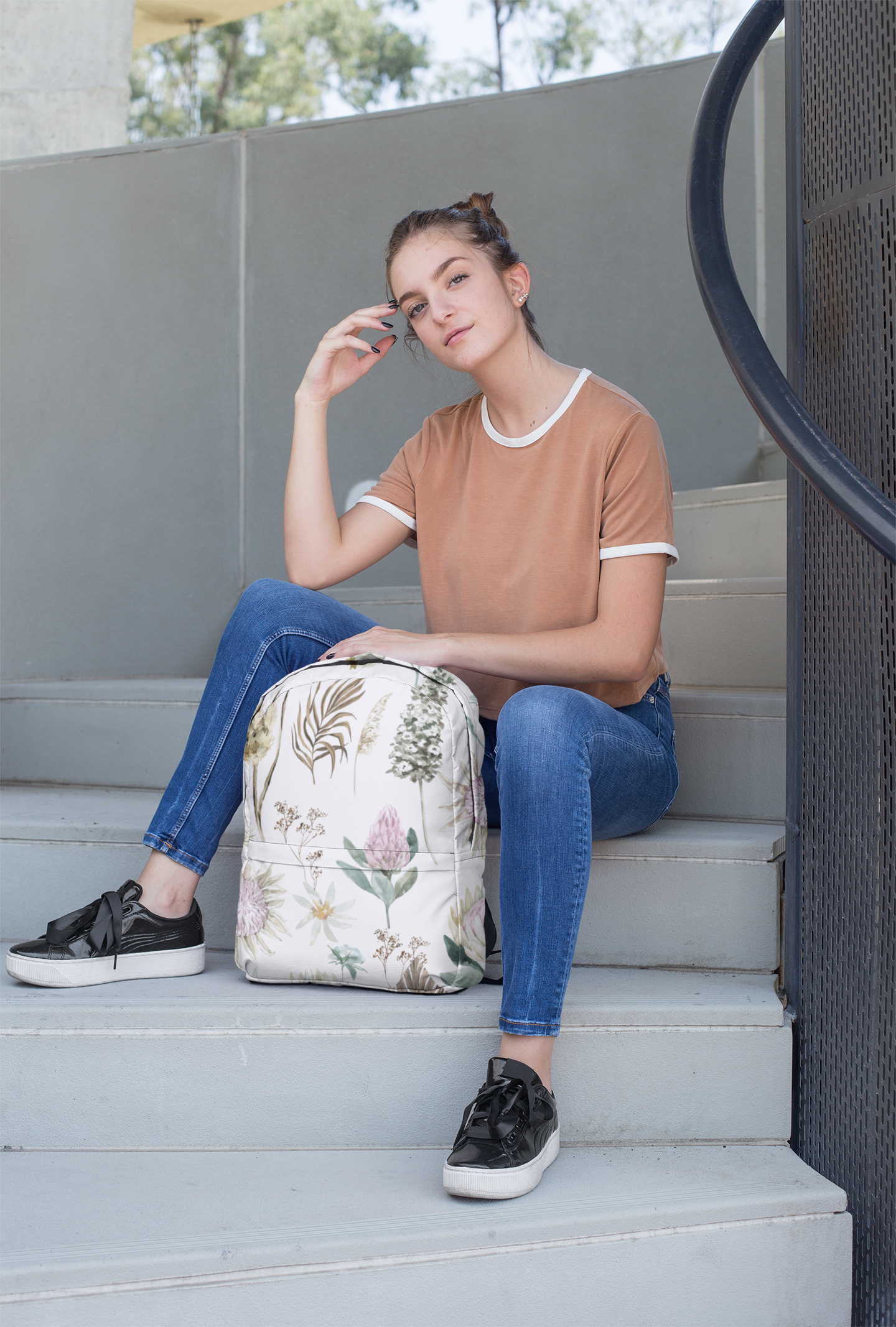 backpack-mockup-featuring-a-female-teenager-sitting-on-a-stairway-27721.png