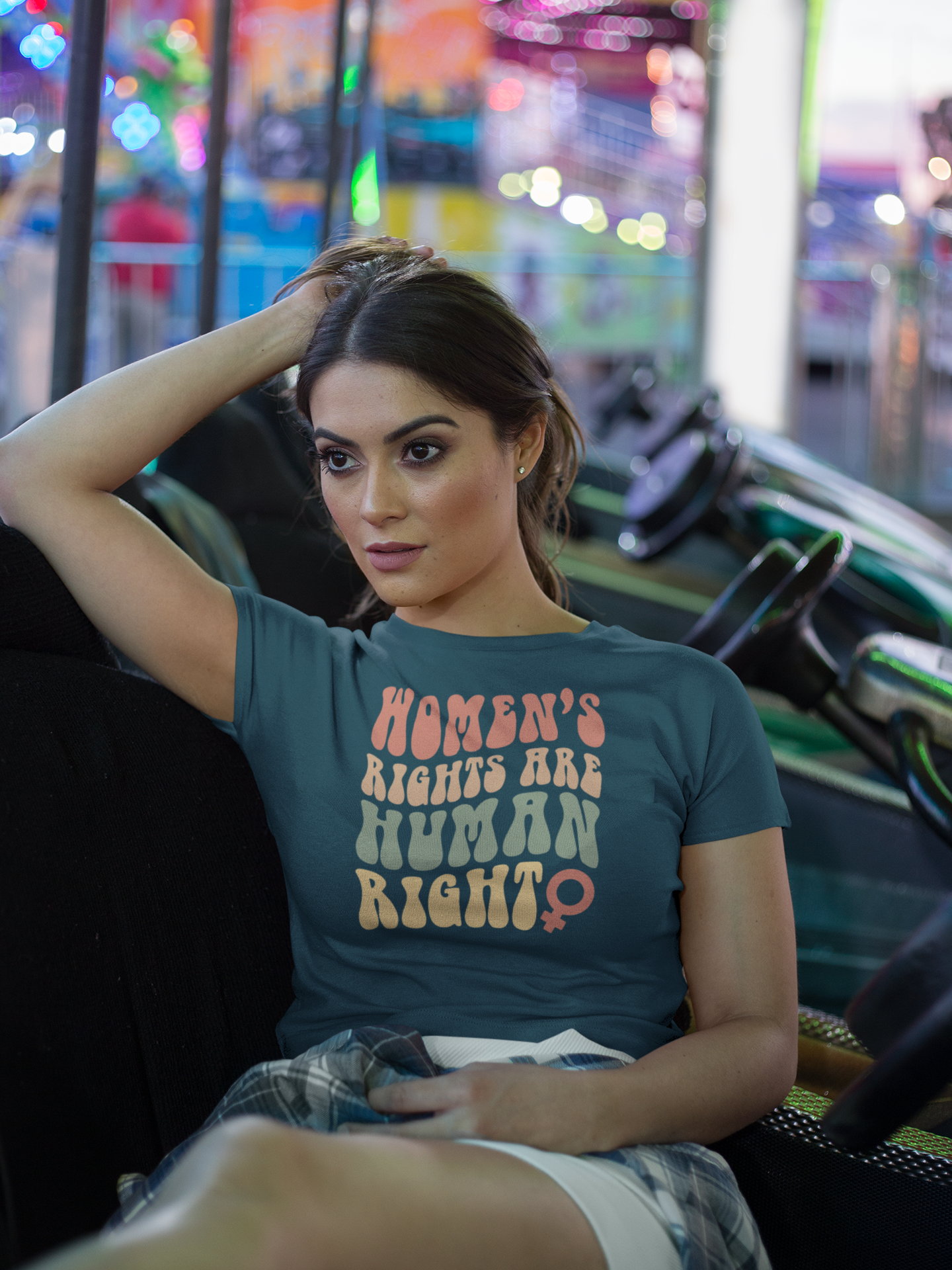 crop-top-tee-mockup-being-worn-by-a-girl-lying-on-the-arcade-car-games-a19440.png