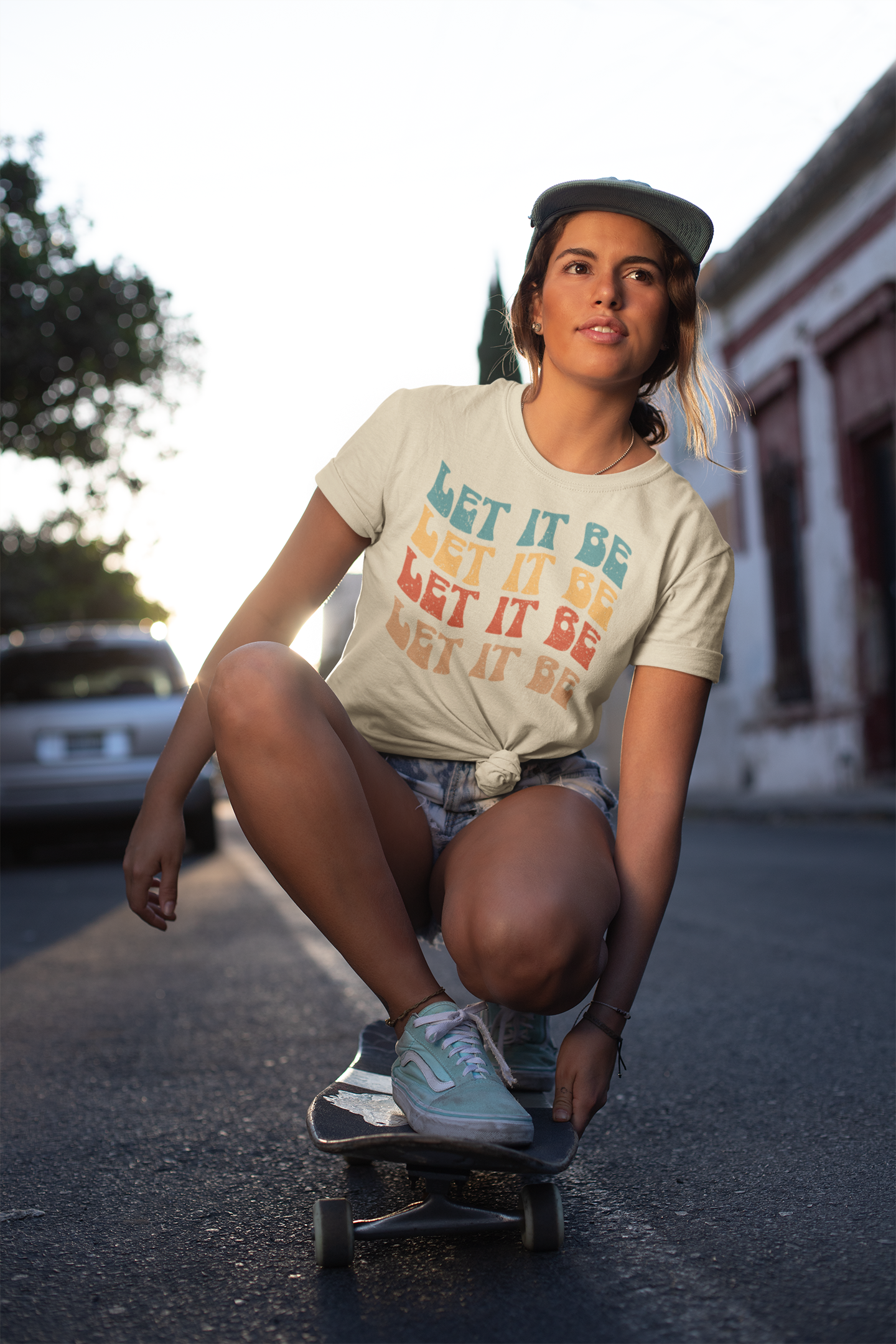 knotted-t-shirt-mockup-of-a-woman-riding-a-skateboard-27079.png