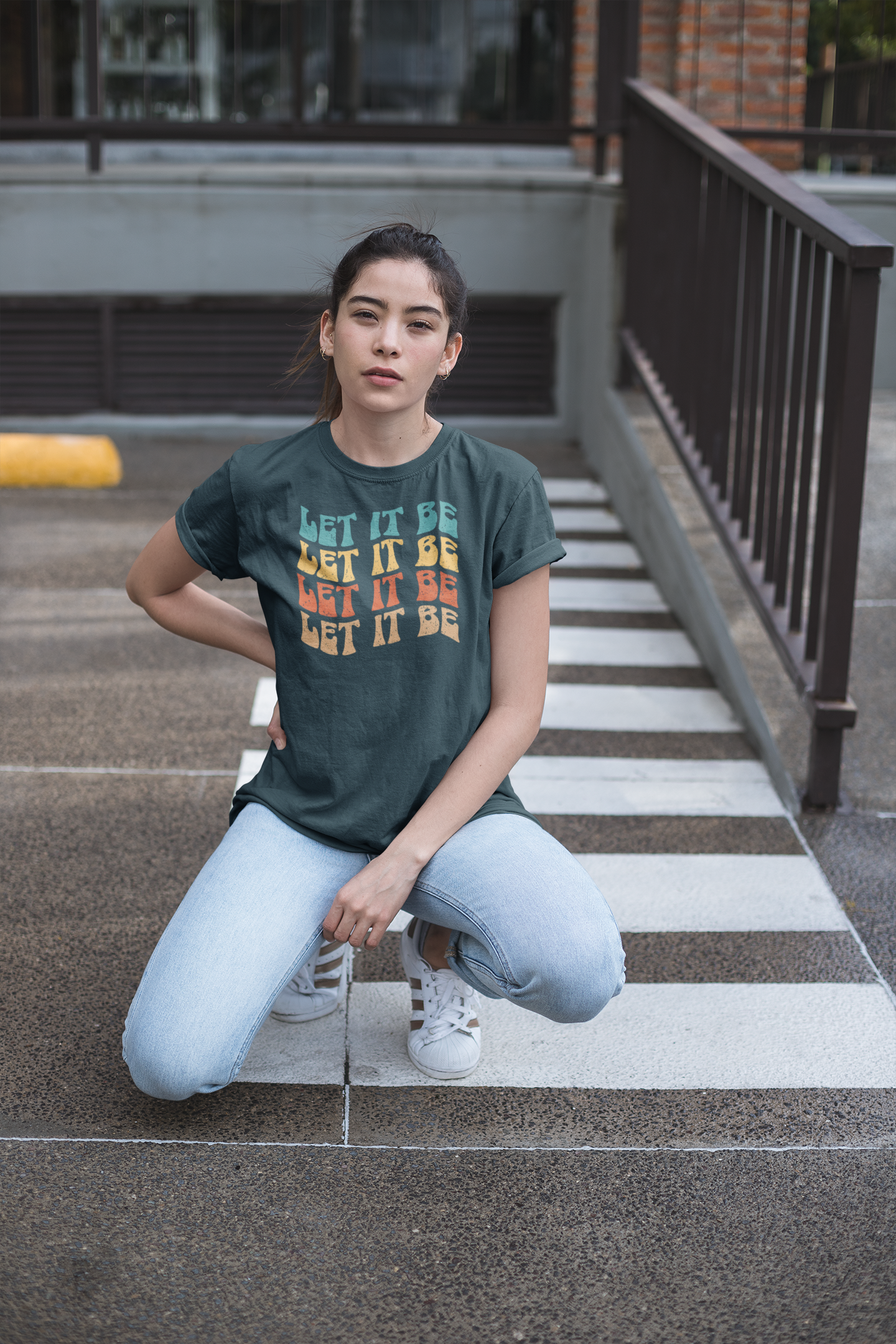unisex-tee-mockup-of-a-woman-posing-in-a-parking-lot-23008.png
