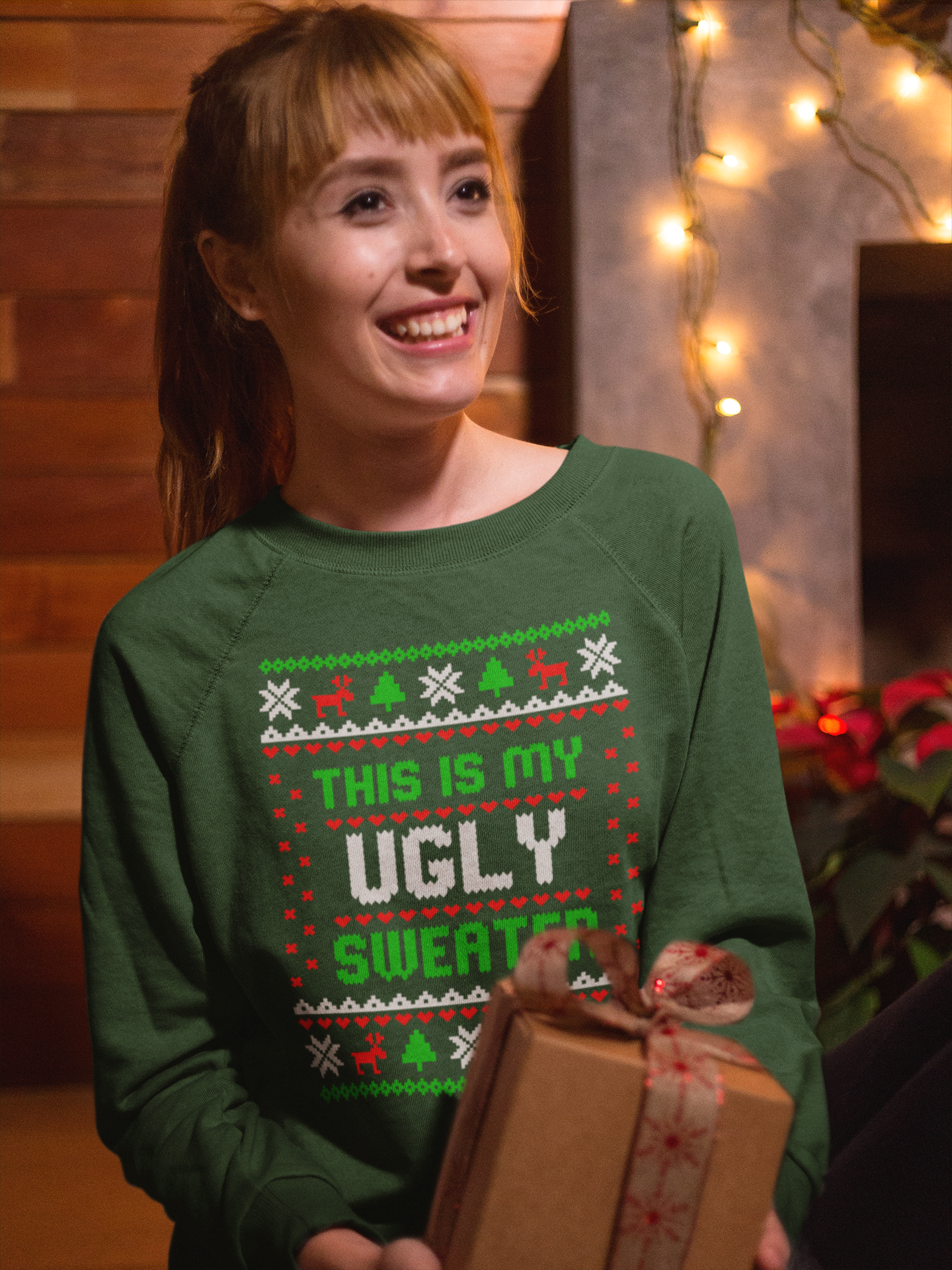 christmas-sweater-mockup-of-a-girl-holding-a-christmas-present-18041.png