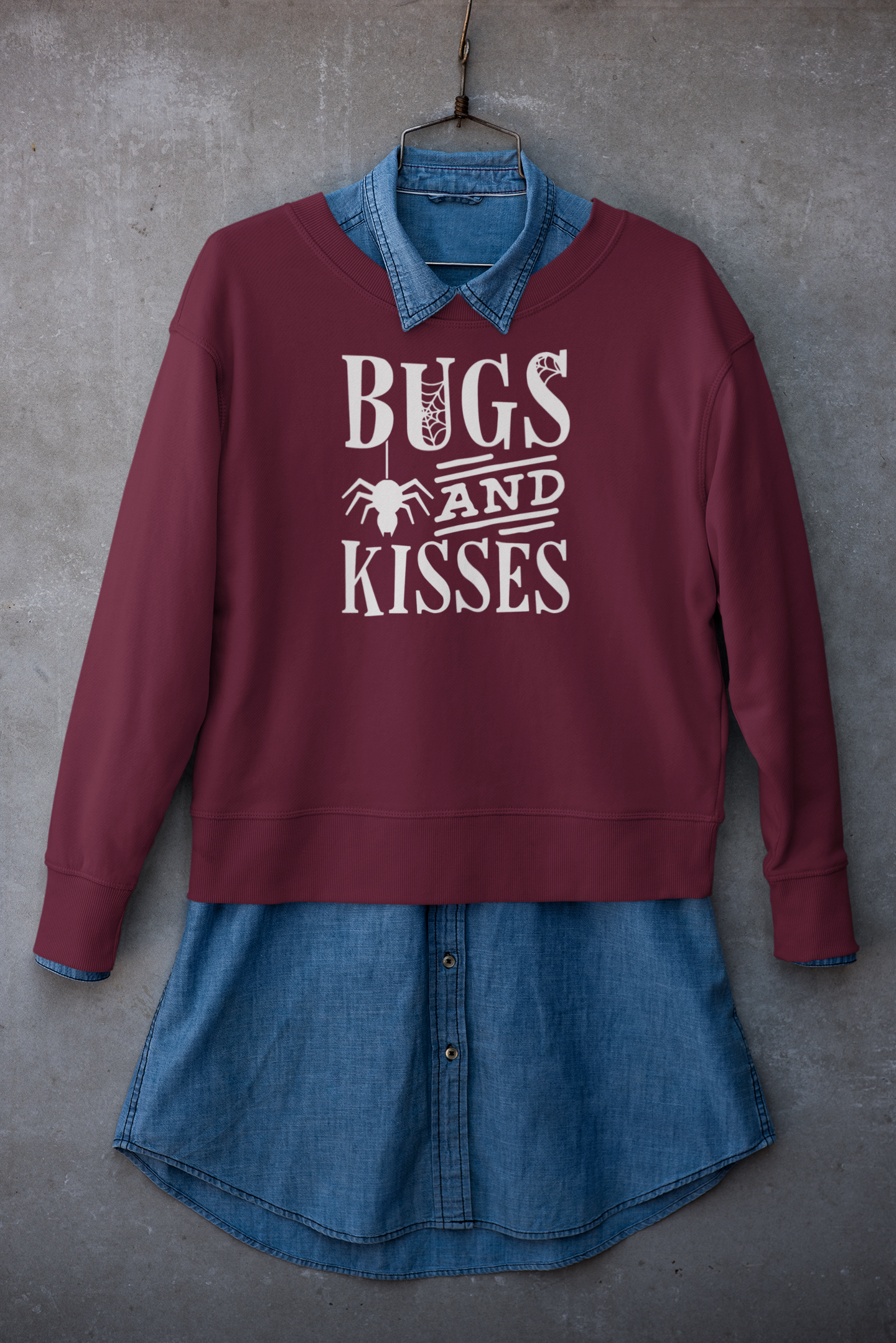 mockup-of-a-crewneck-sweatshirt-placed-on-a-hanger-with-a-denim-garment-33981.png