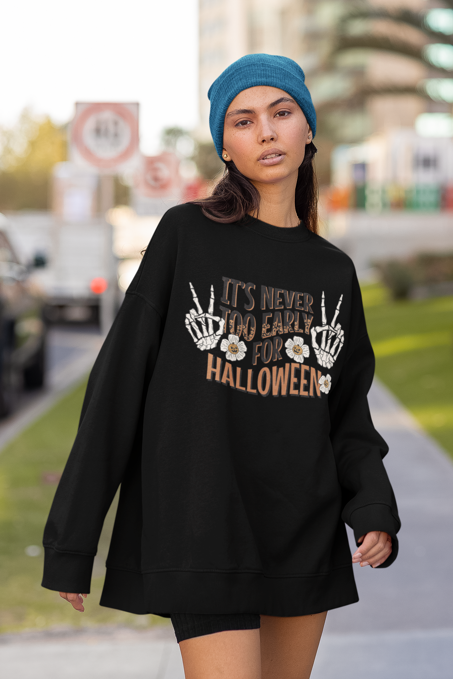 oversized-sweatshirt-with-sleeves-mockup-featuring-a-woman-posing-in-the-street-m25283.png