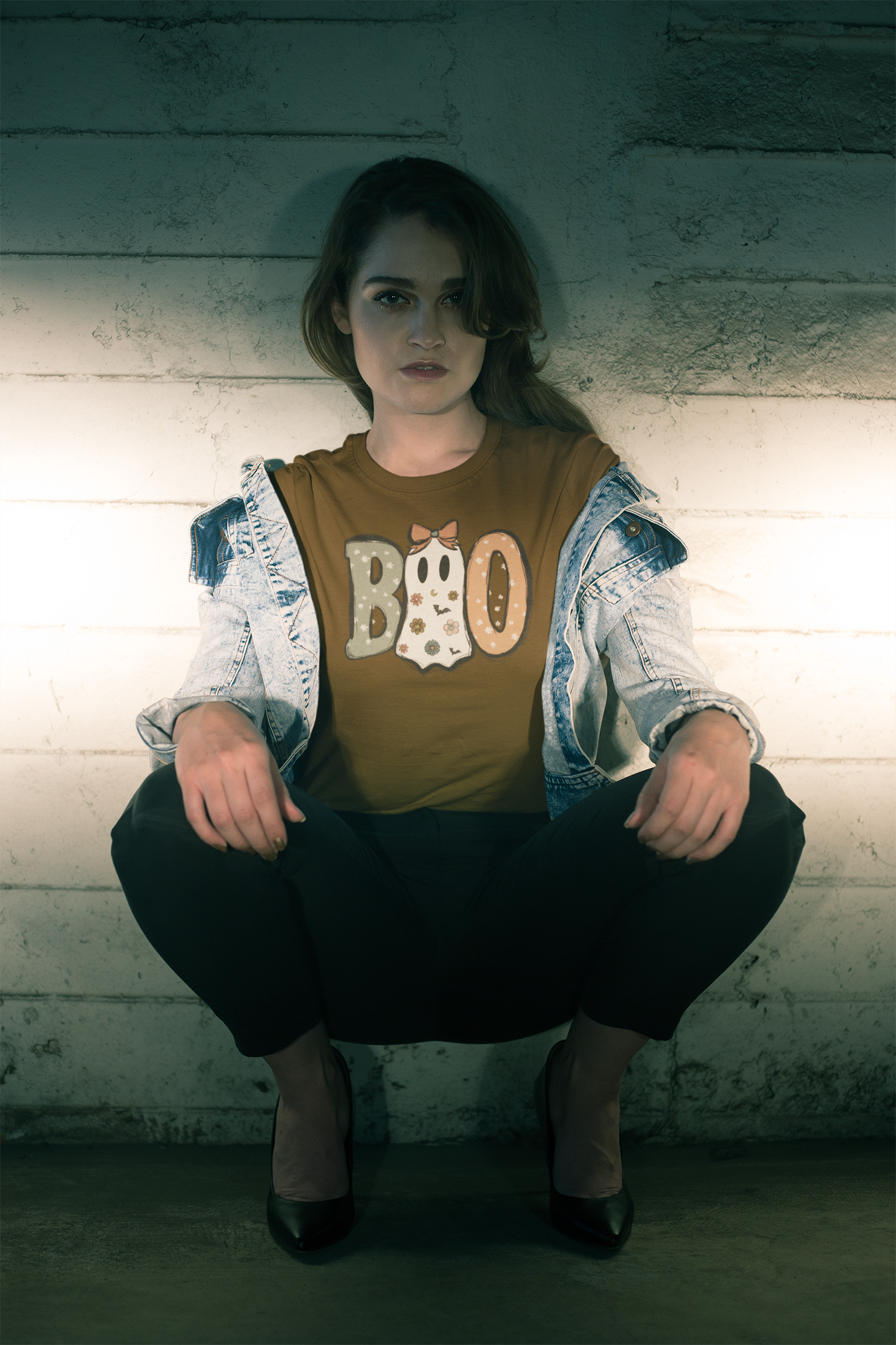 tshirt-mockup-of-a-handsome-female-model-crouching-at-night-20068.png