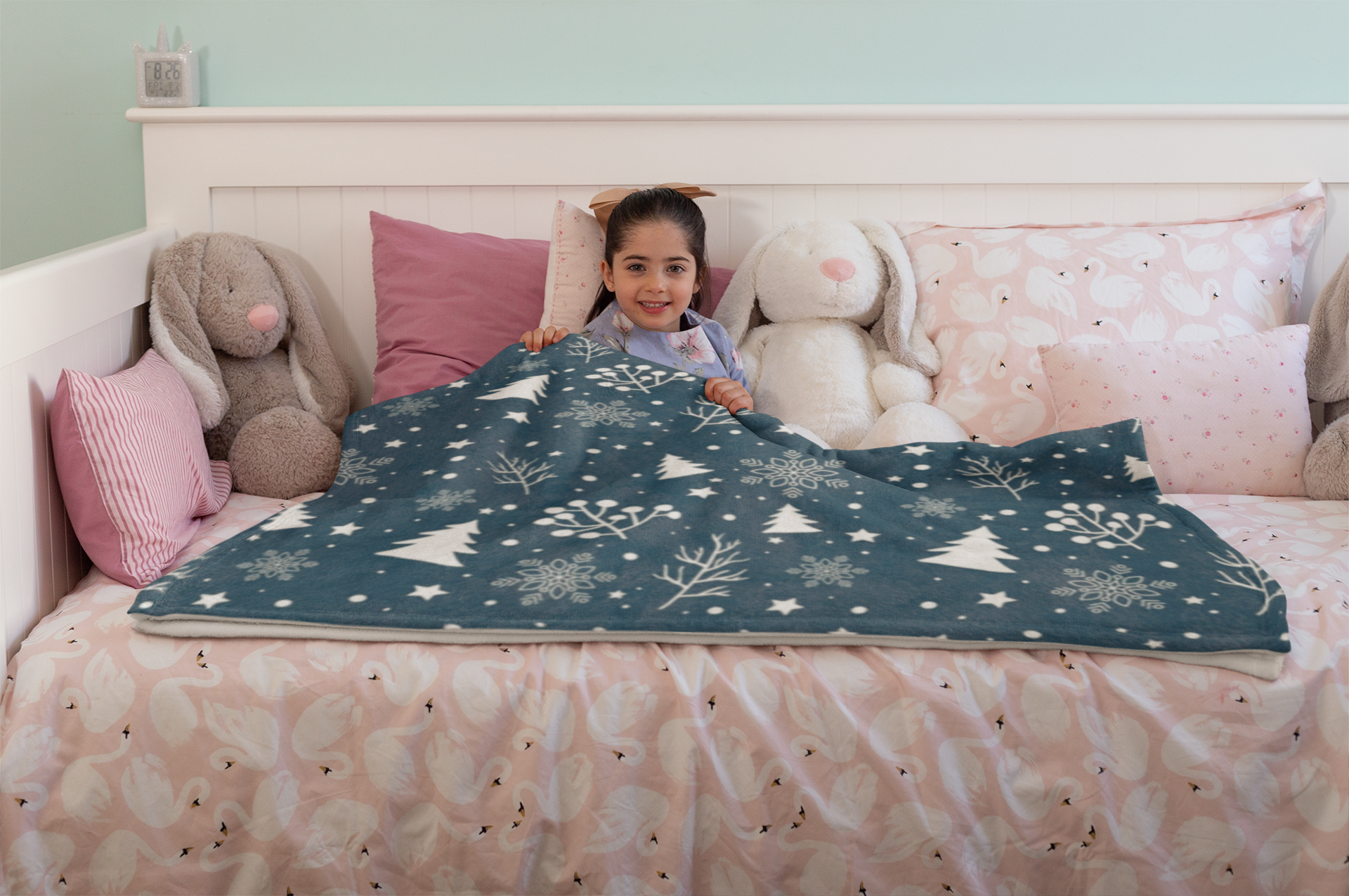 mockup-of-a-happy-little-girl-lying-under-a-throw-blanket-on-her-bed-24688.png