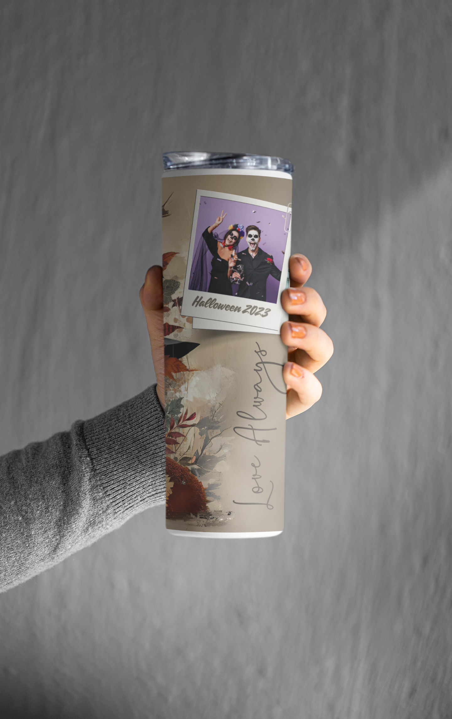 mockup-featuring-a-woman-s-hand-holding-a-skinny-tumbler-against-a-grey-wall-m21471.png