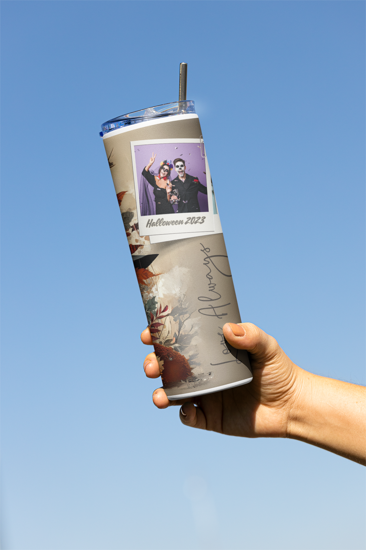 mockup-of-a-woman-s-hand-raising-a-skinny-tumbler-in-the-air-m21473.png
