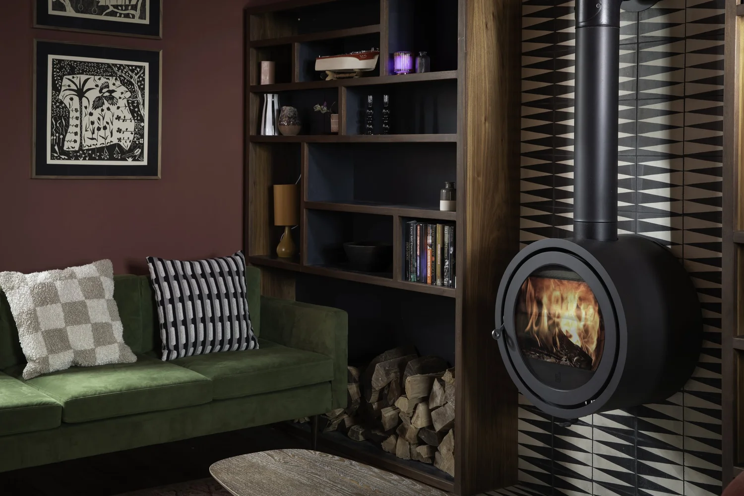 Snug with wood burner and bookshelves at Zennor Sounds Studio, photographed by Pip Hambling
